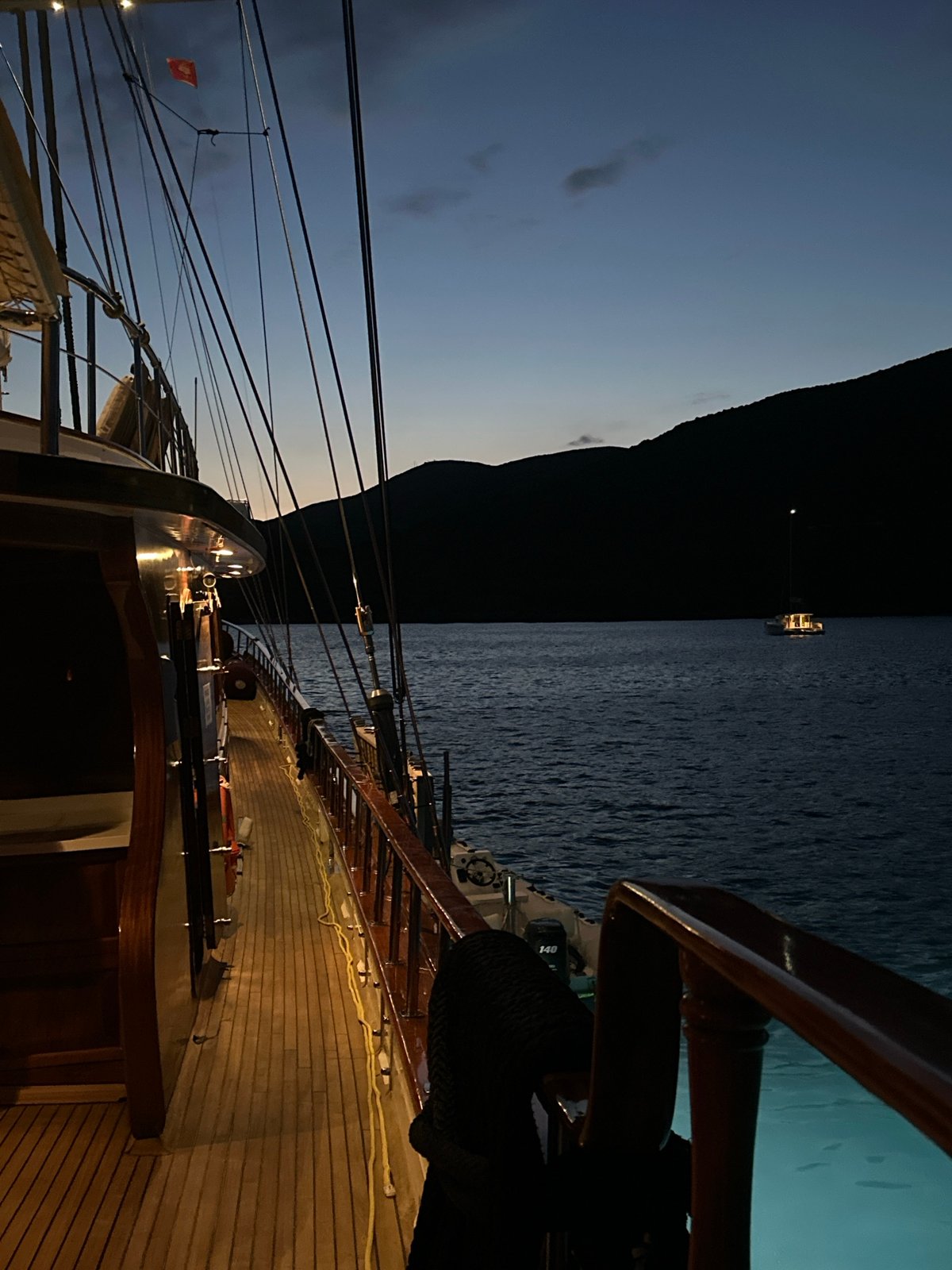 Illuminated sailboat deck photographed at night in Montenegro waters
