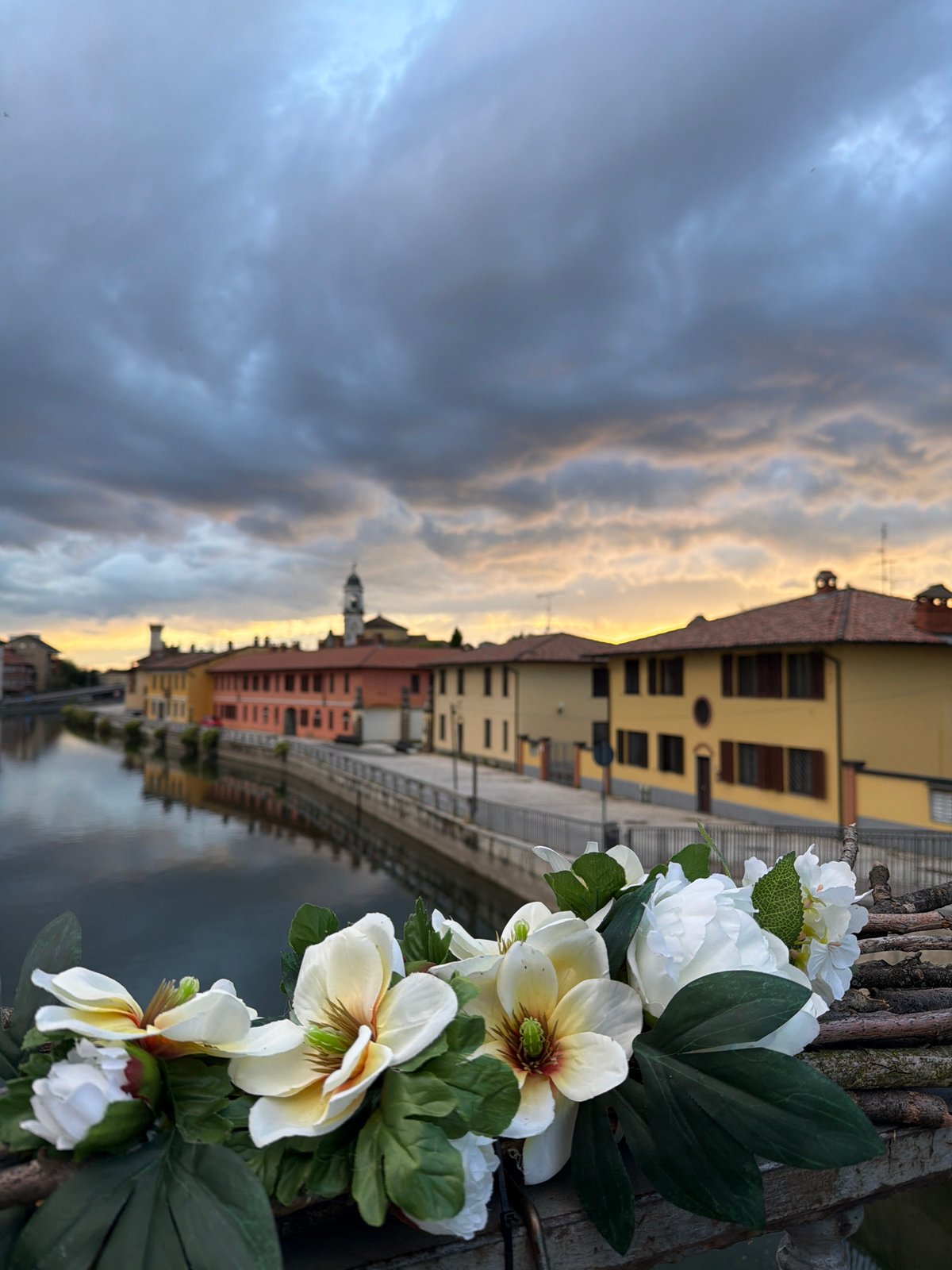 Canal views documented in Bonirola, Italy during evening hours