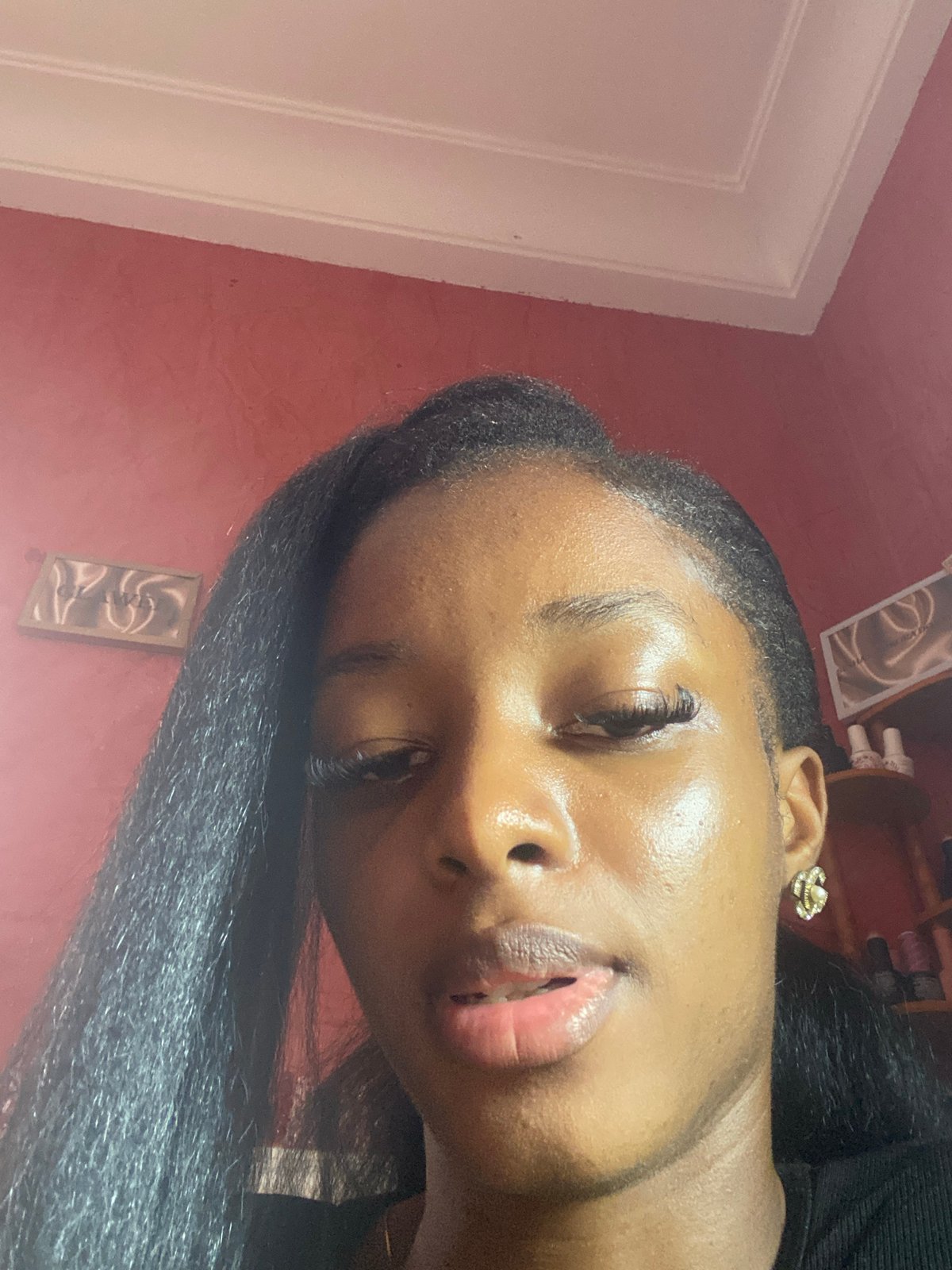 Woman takes selfies indoors in Jos, Nigeria