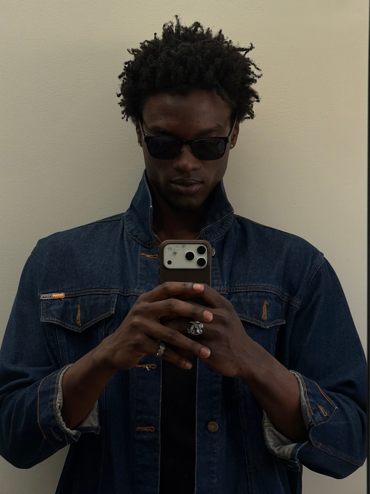 Person takes mirror selfies indoors in London