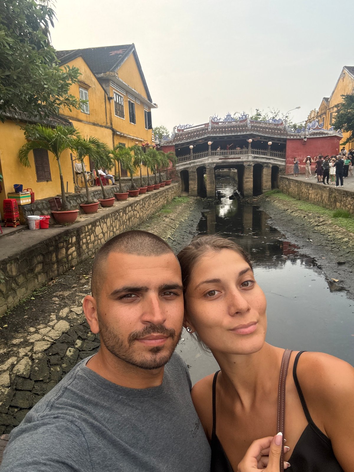 Tourists photograph themselves at Hội An's Japanese Covered Bridge