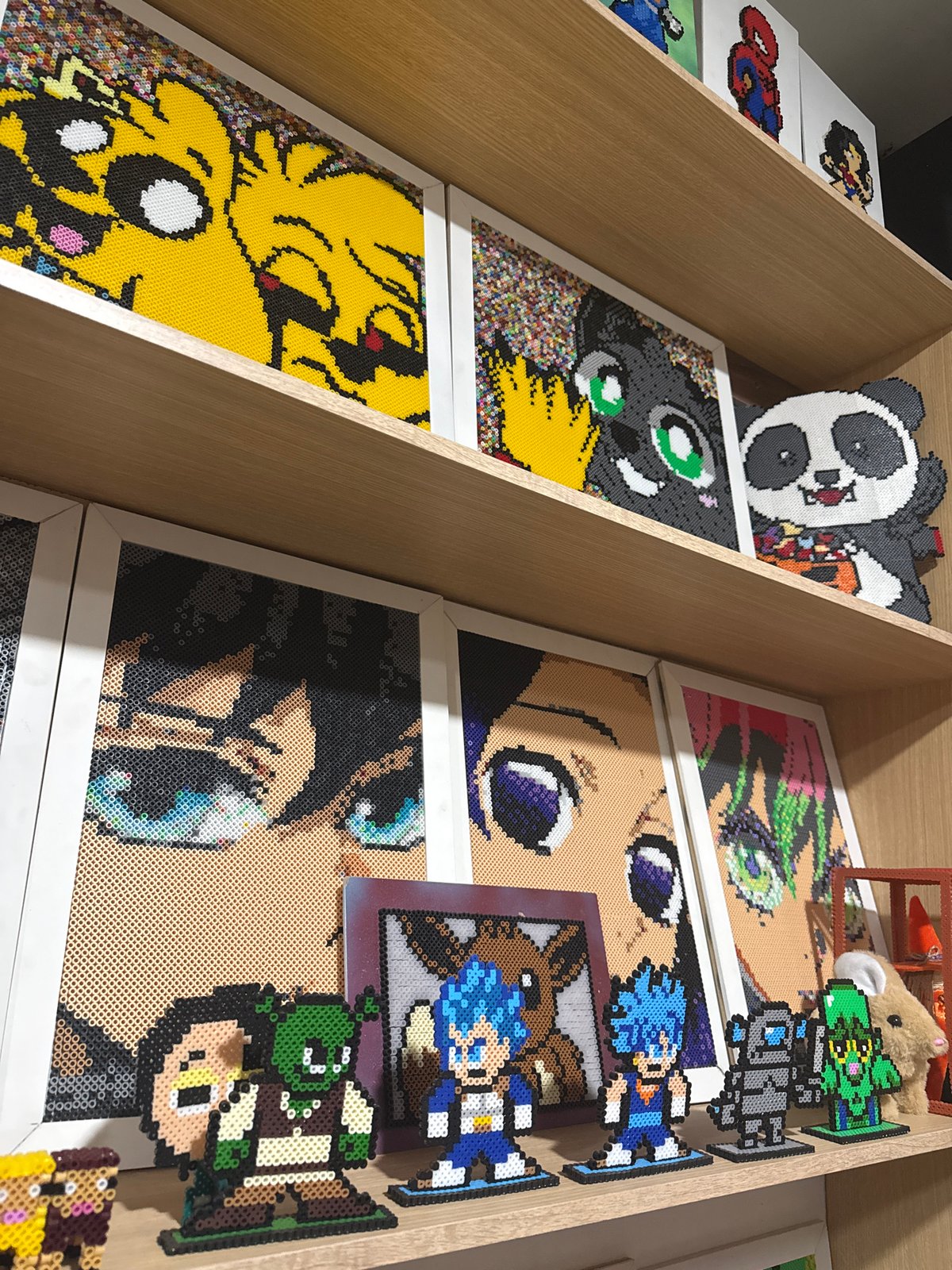Perler bead anime artwork displayed on shelves in Puebla