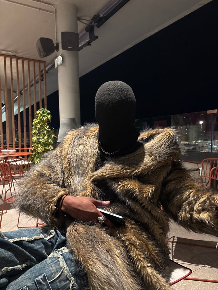 Masked individual spotted at Barcelona rooftop venues during evening outing