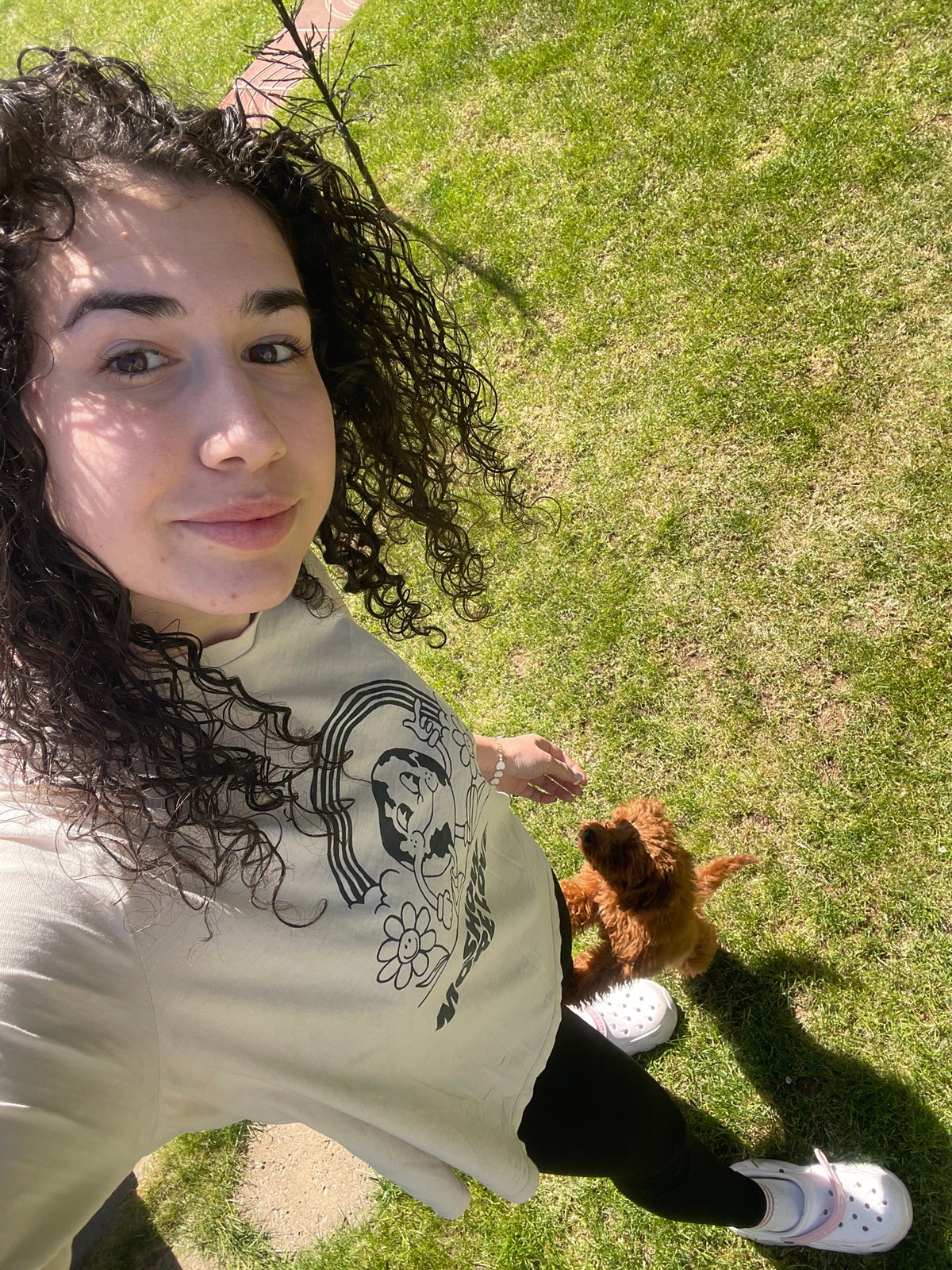 Woman and puppy enjoy sunny afternoon in Sofia garden