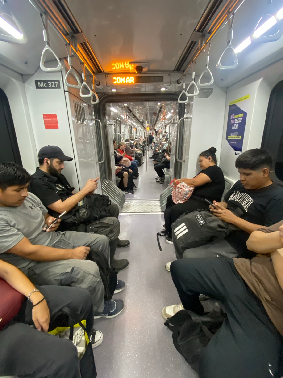 Crowded commuter train documented in Buenos Aires evening rush