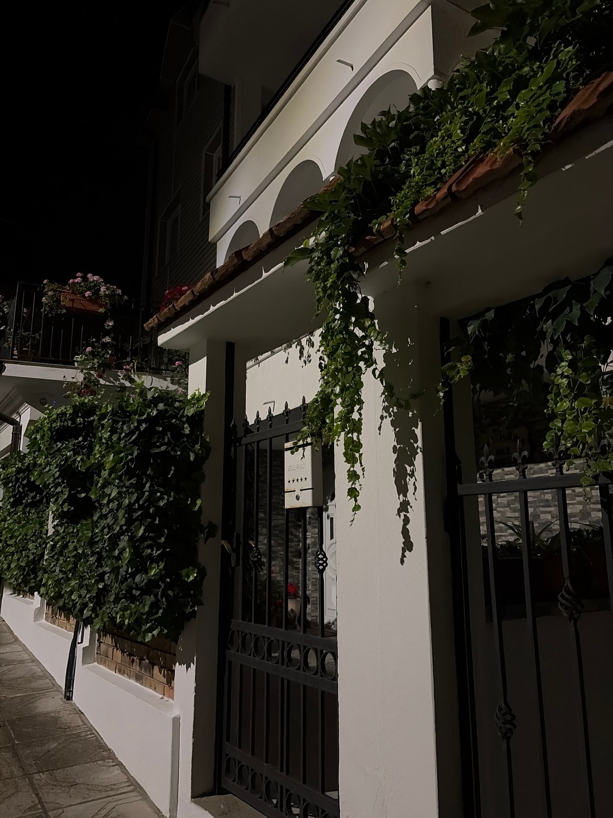 Night stroll around a flower-filled building in Obzor