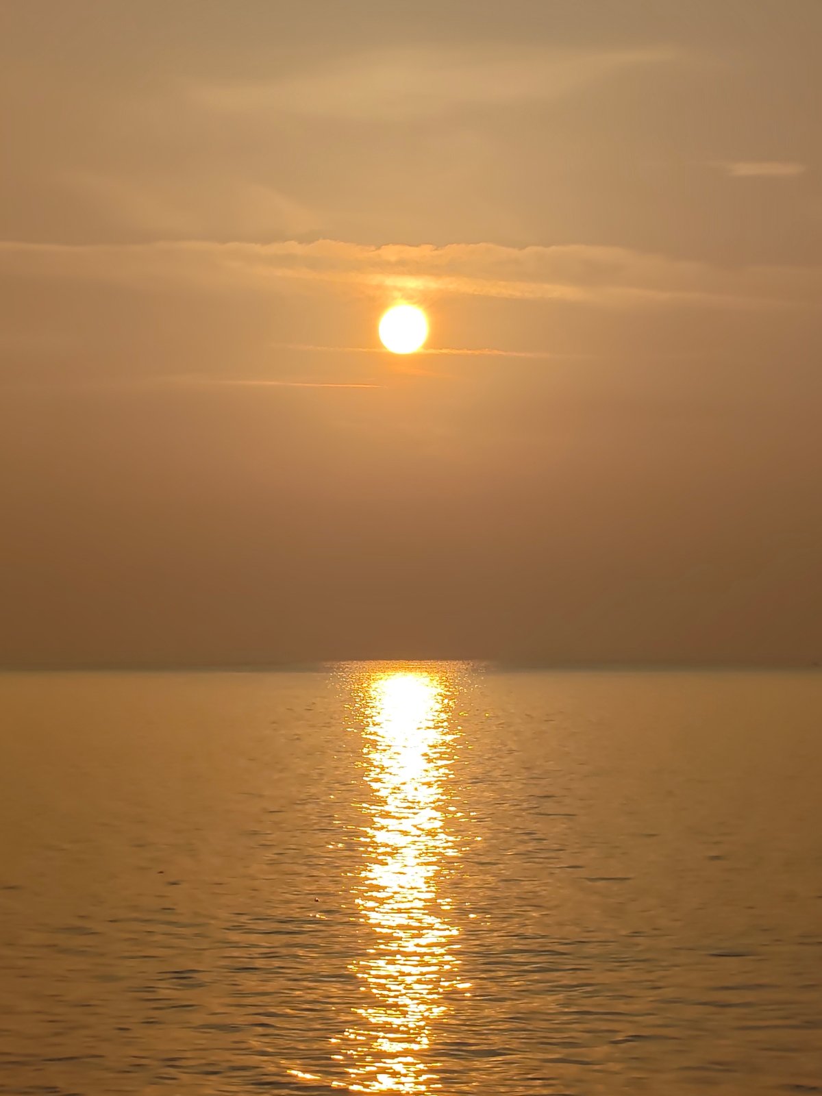Sunset over the water in Lhokseumawe, Indonesia