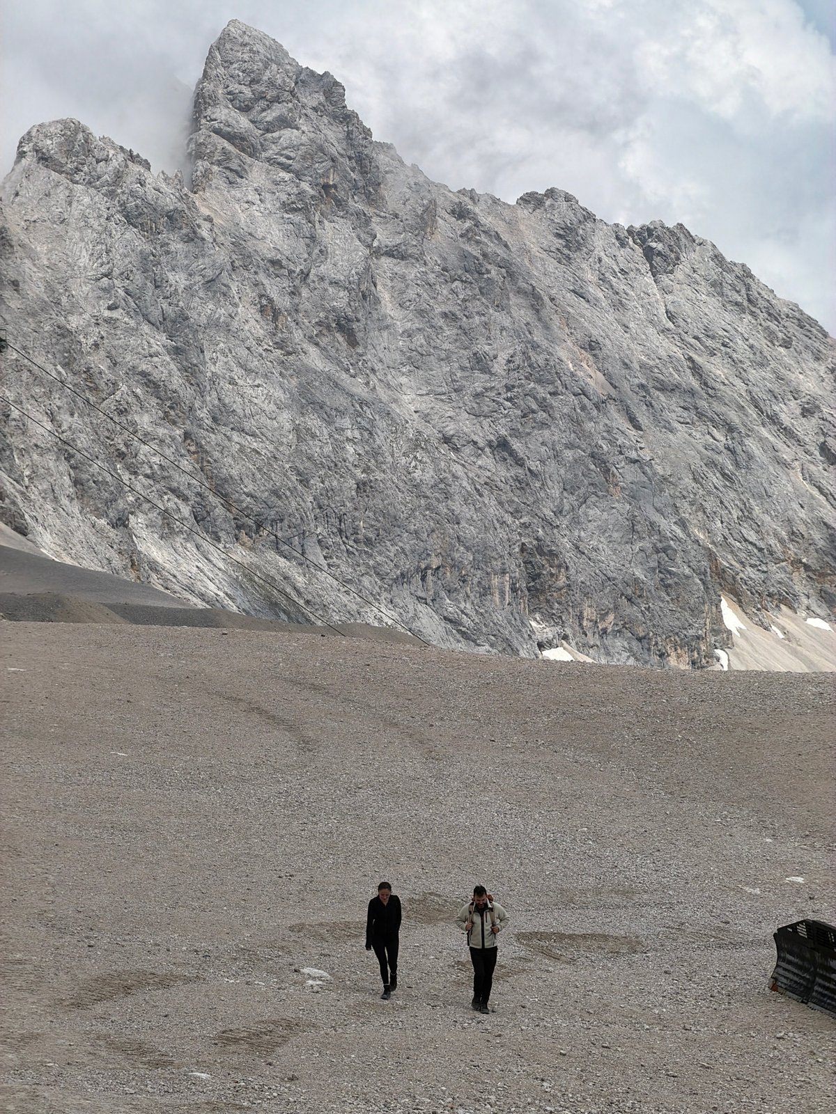 Exploring the Zugspitze summit on a cloudy summer day