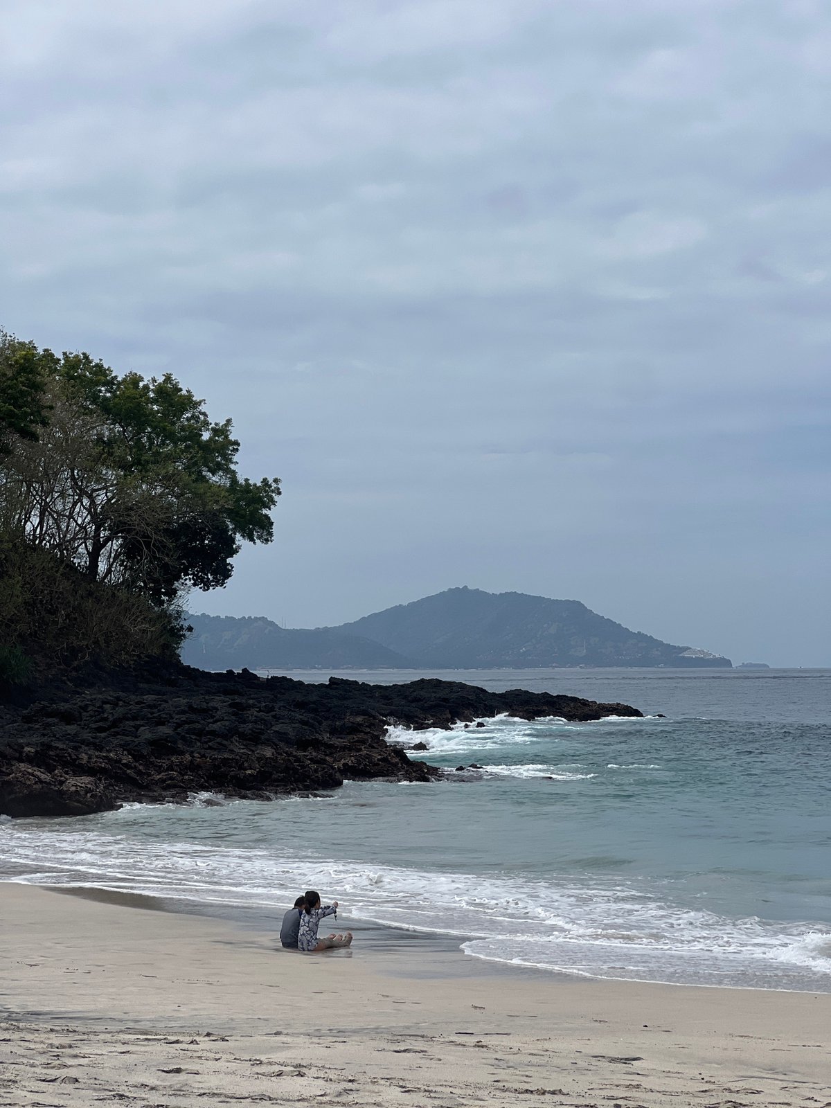 Beach day in Manggis with kids, waves, and shoreline strolls