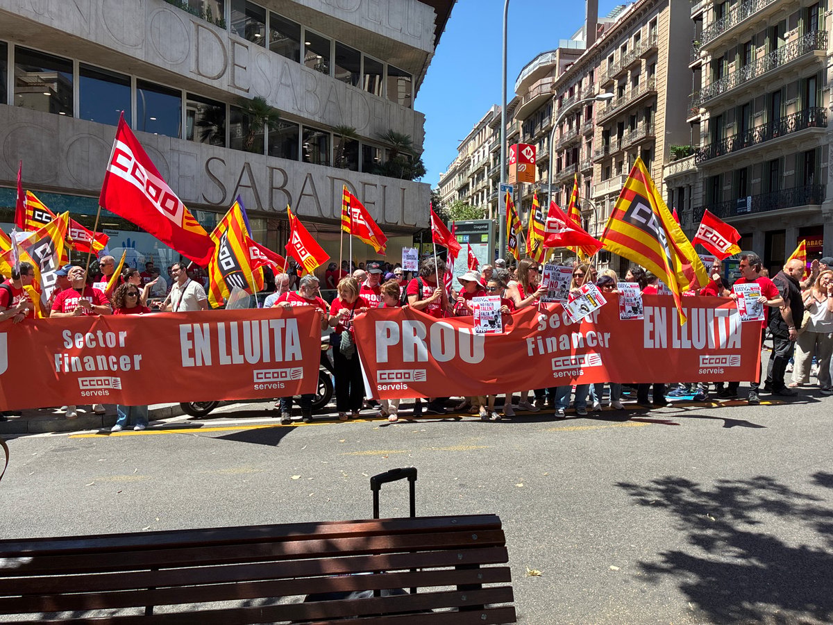 Street protest with red-shirted demonstrators unfolds in Barcelona