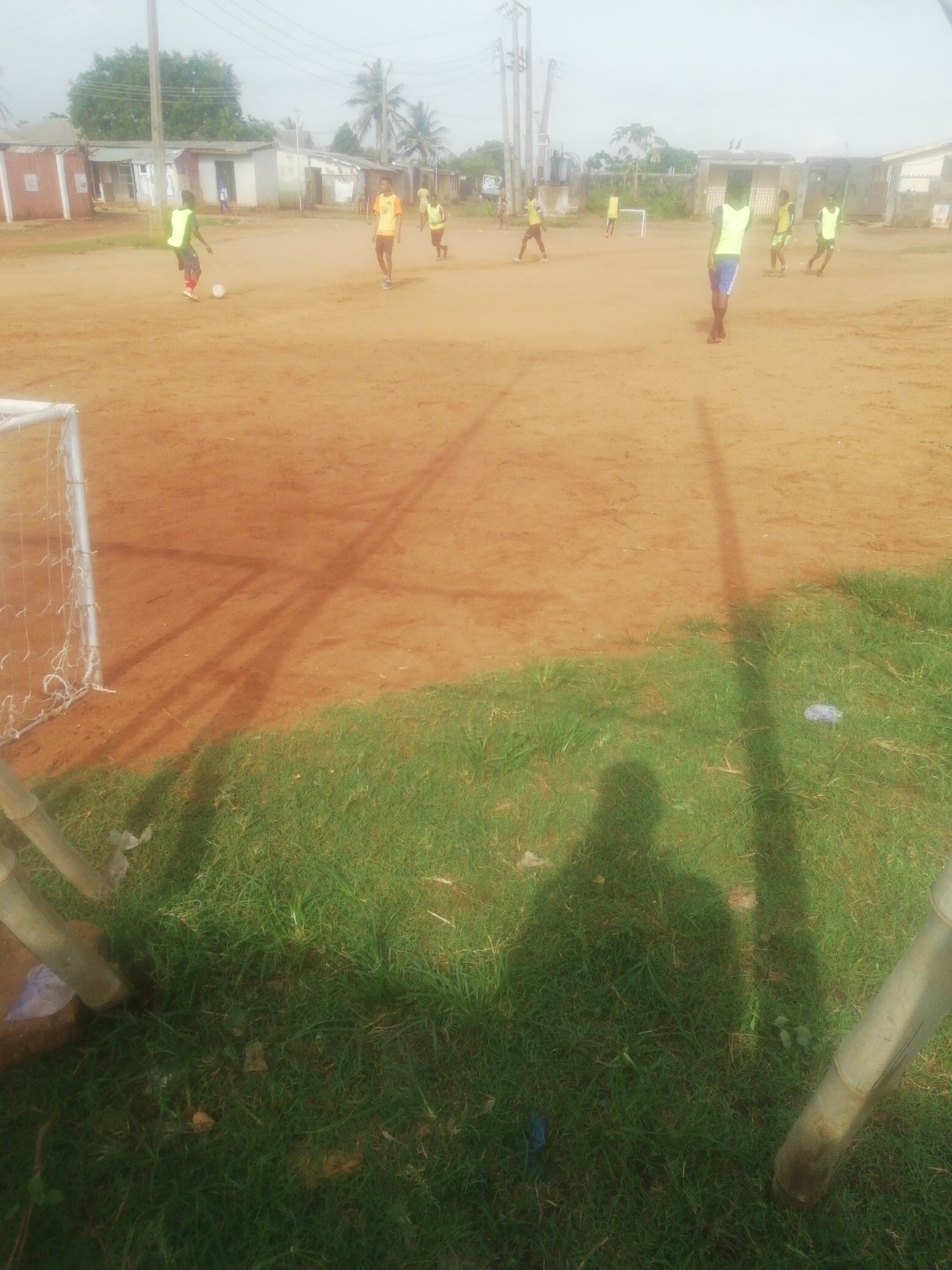 Young players enjoy soccer game on dirt field in Ikorodu