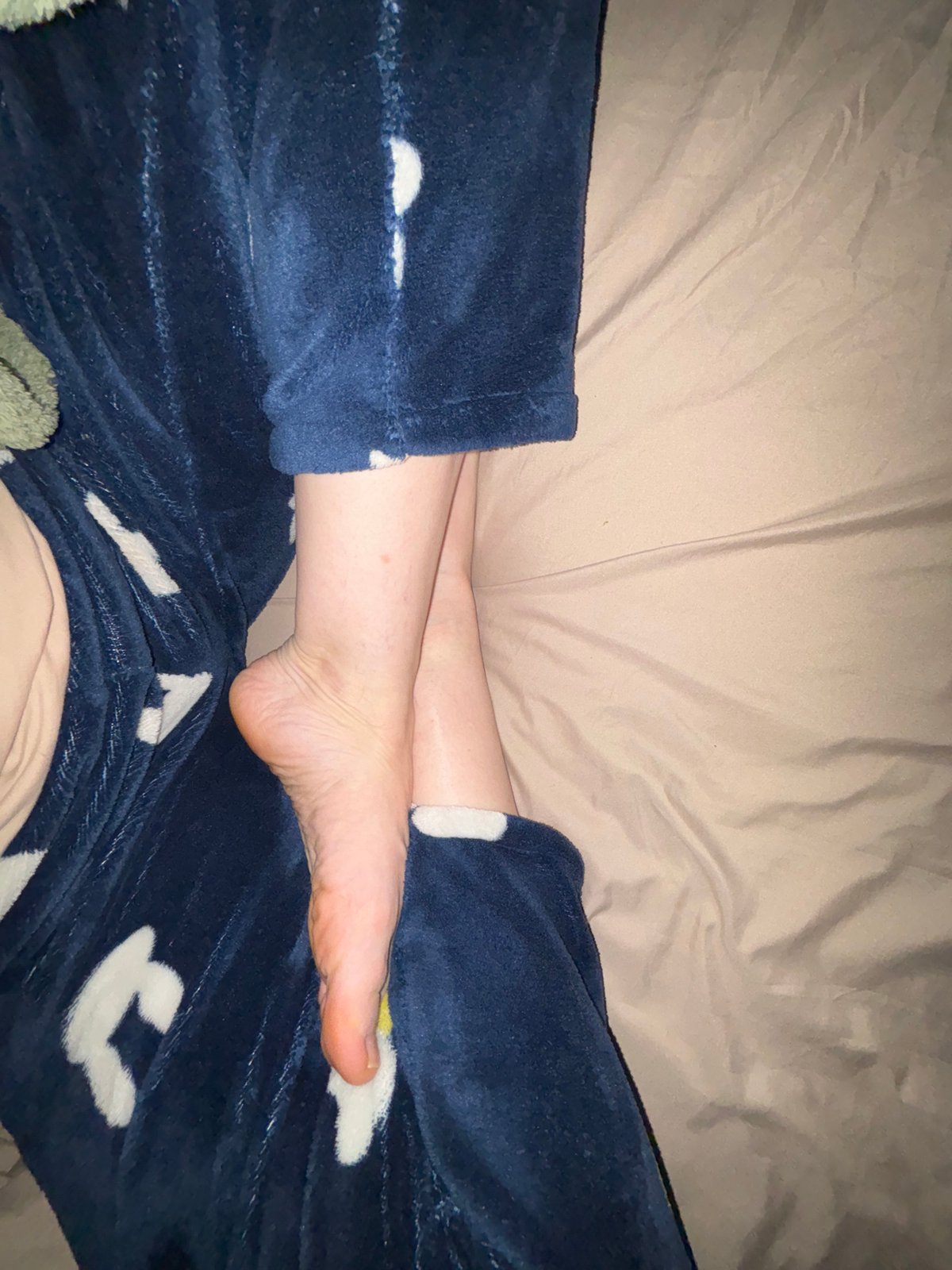 Person in blue pajamas photographed at home in Murino