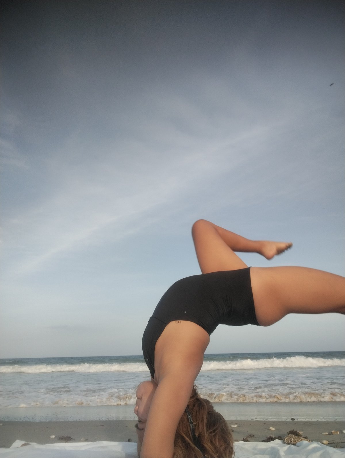 Beach yoga session captured in Porlamar, Venezuela