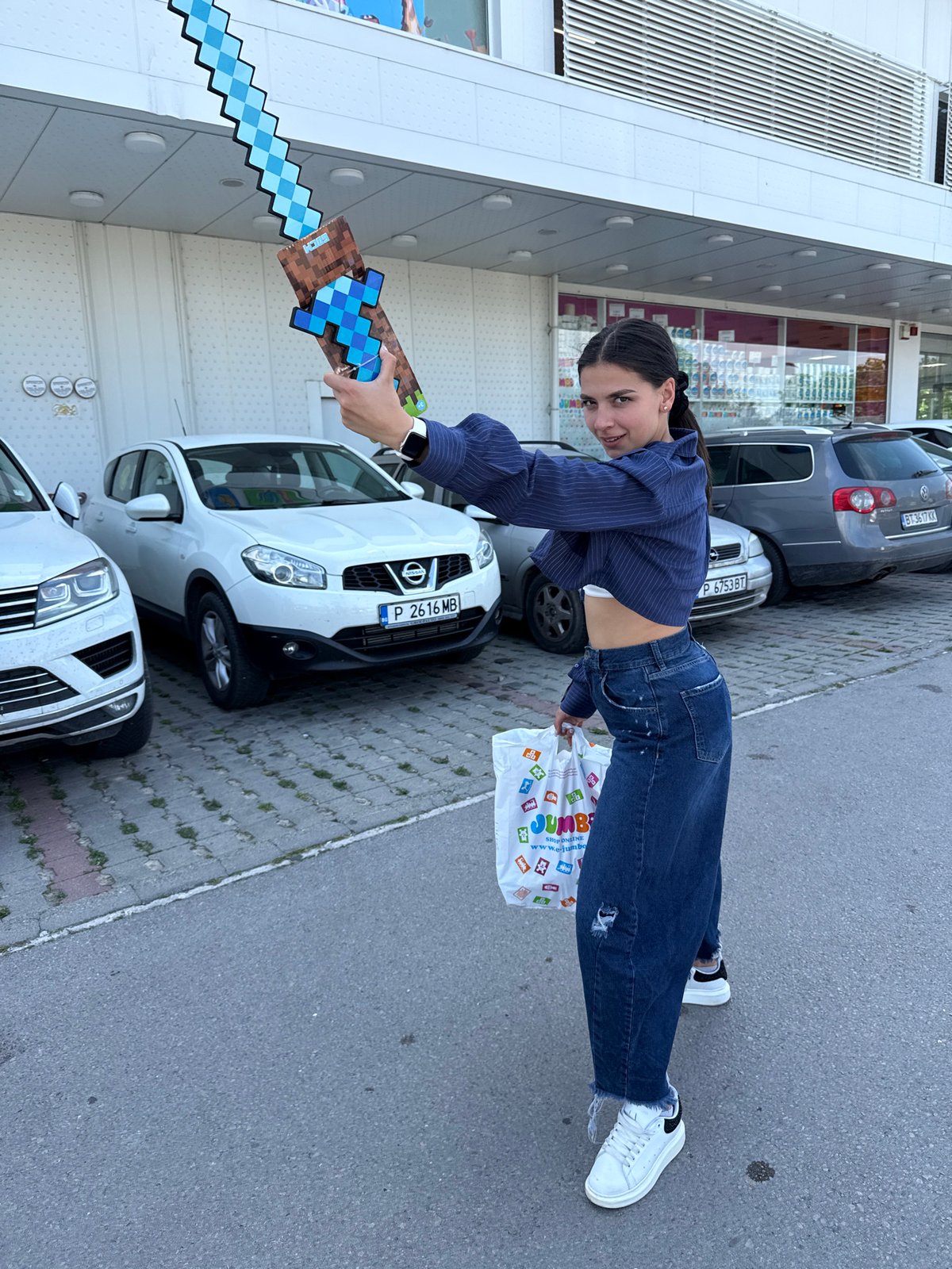 Couple documents shopping trip with props at Jumbo store