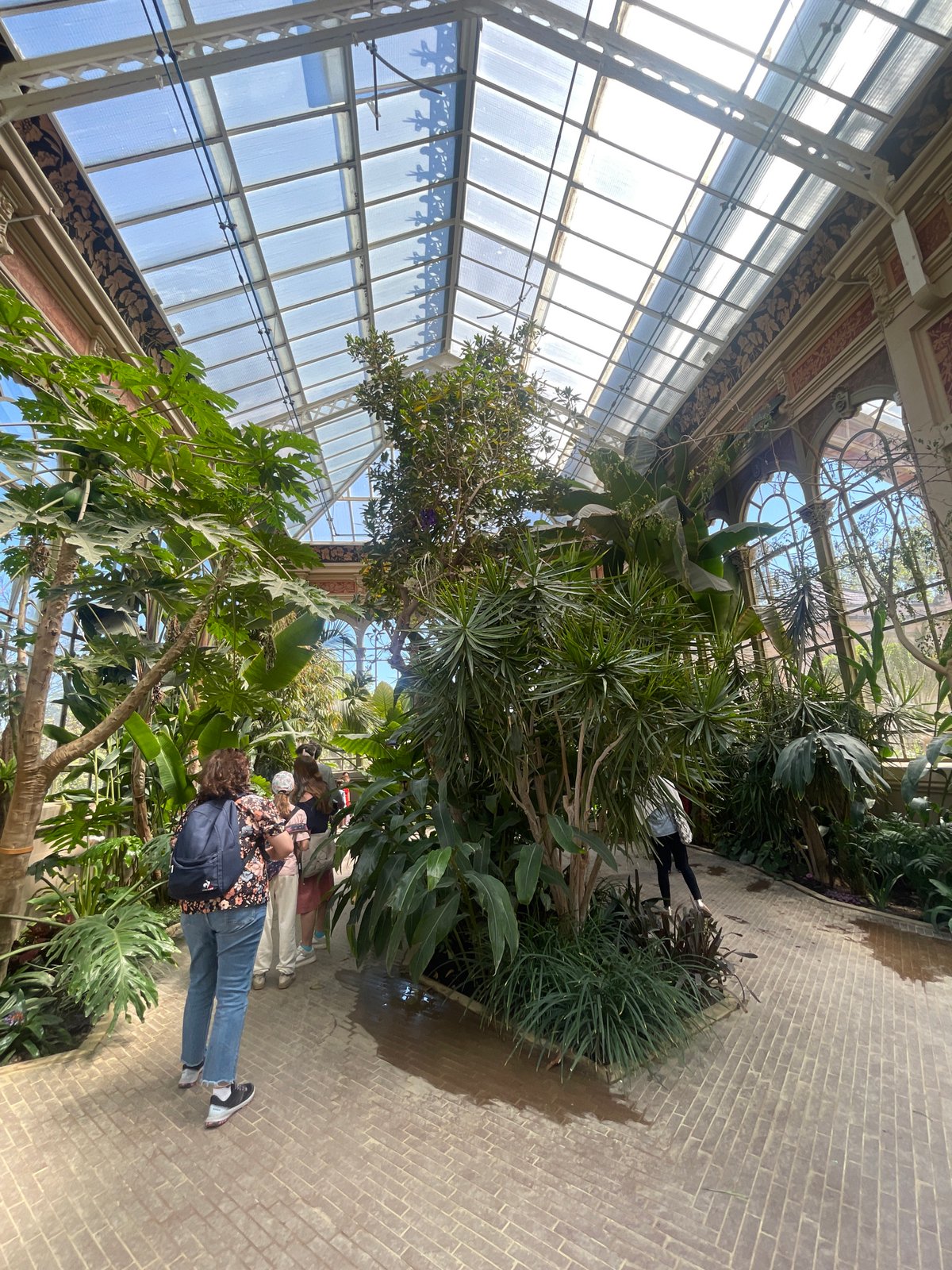 Visitors tour botanical greenhouse exhibits in Barcelona