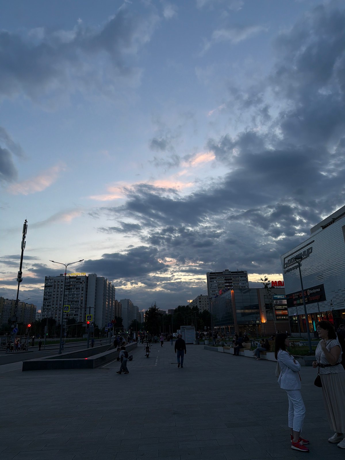 Dramatic cloudy skies observed over Moscow street scene