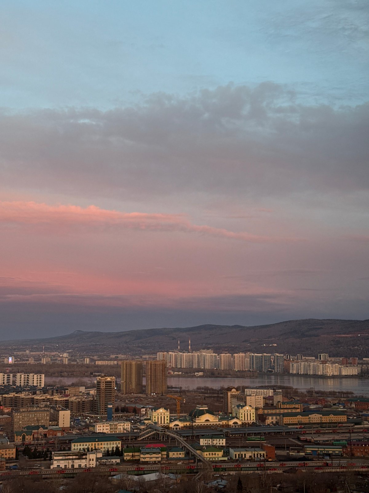 Krasnoyarsk cityscape documented during twilight transition April 27