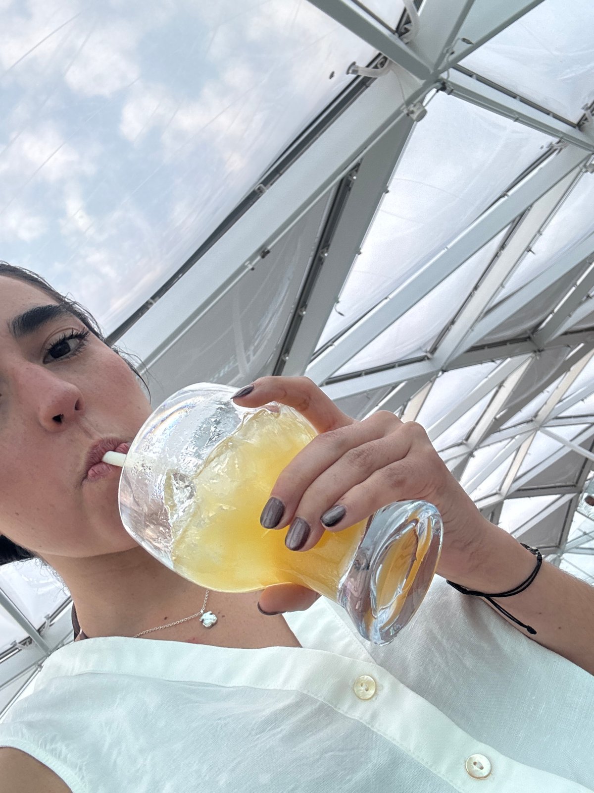 Woman enjoys yellow drink in Cape Canaveral area