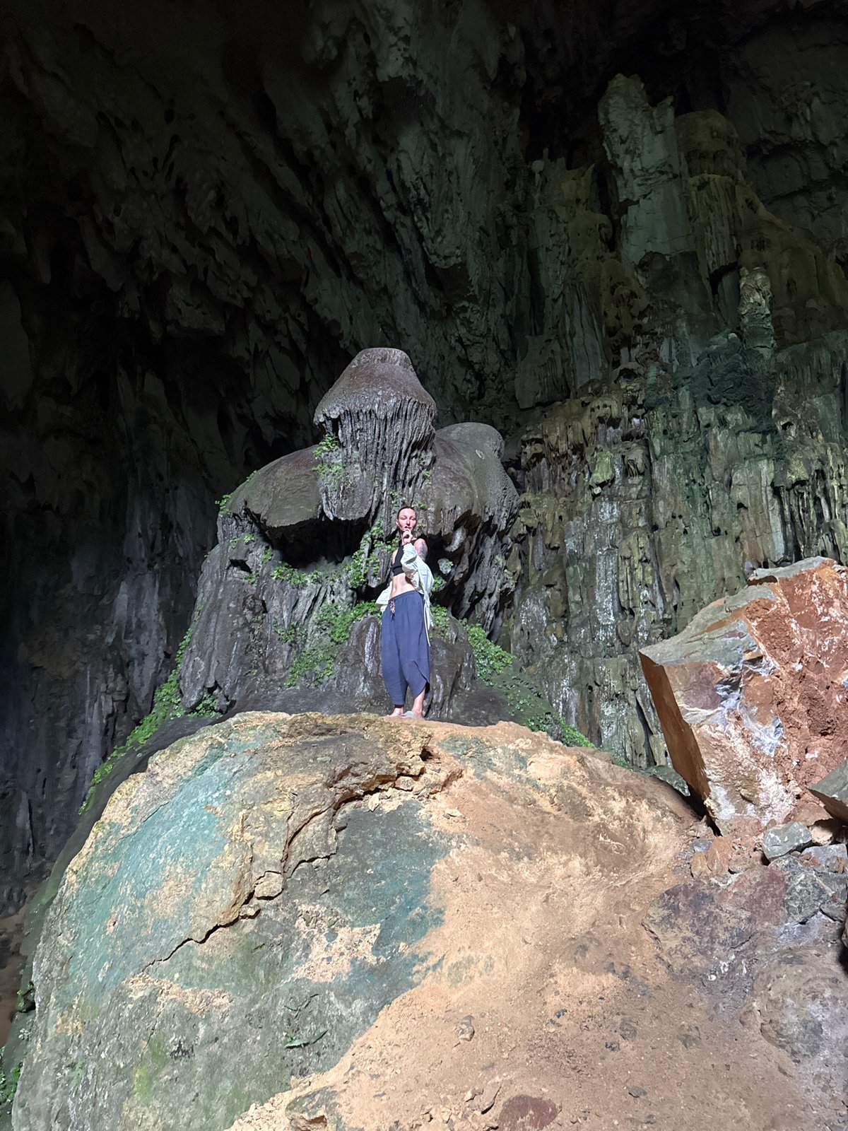 Tourists explore cave formations in Vietnam's Pù Luông Commune