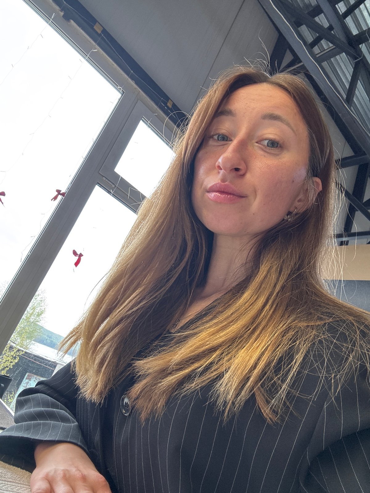 Woman poses for photos in office in Chaikovsky, Russia