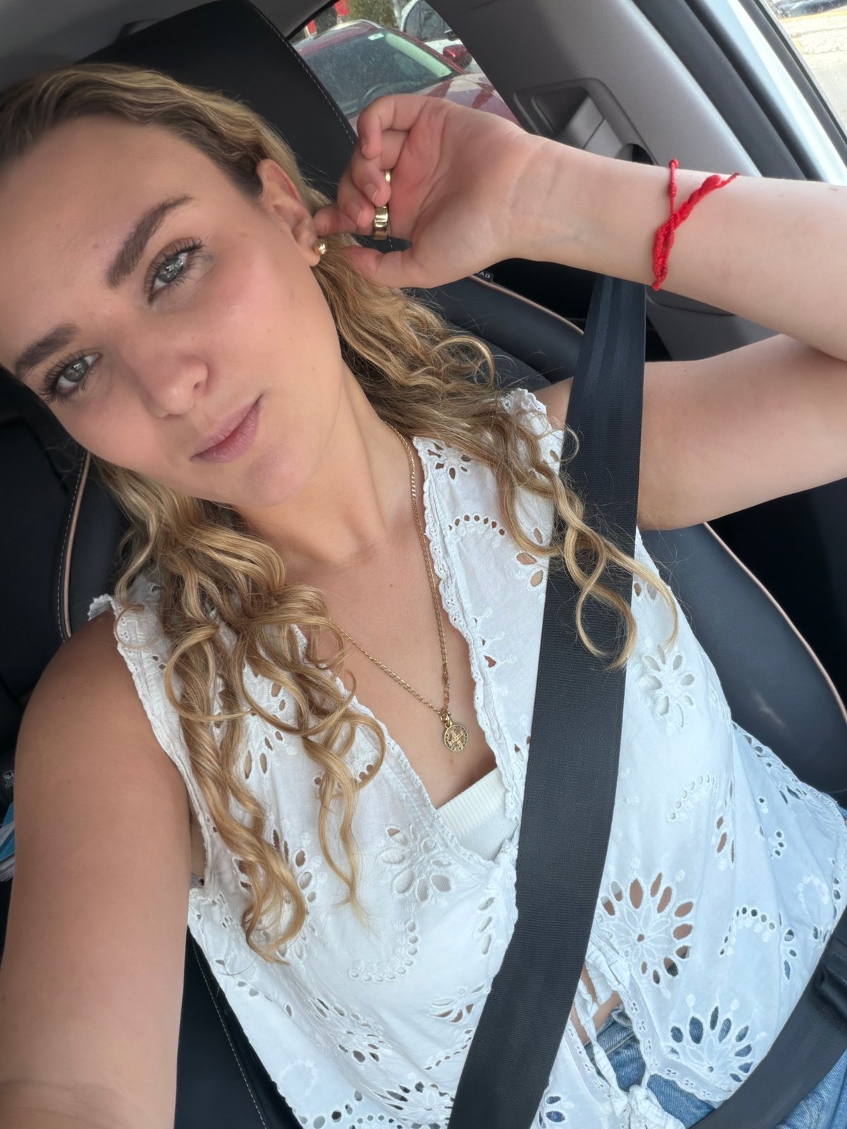 Woman takes selfies in car in Tlaxcalancingo, Mexico