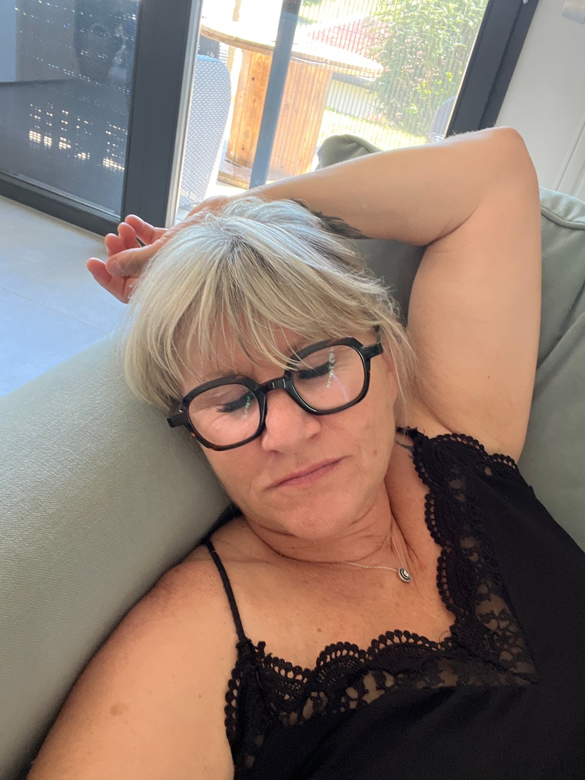 Woman rests, drinks water at home in Chambœuf