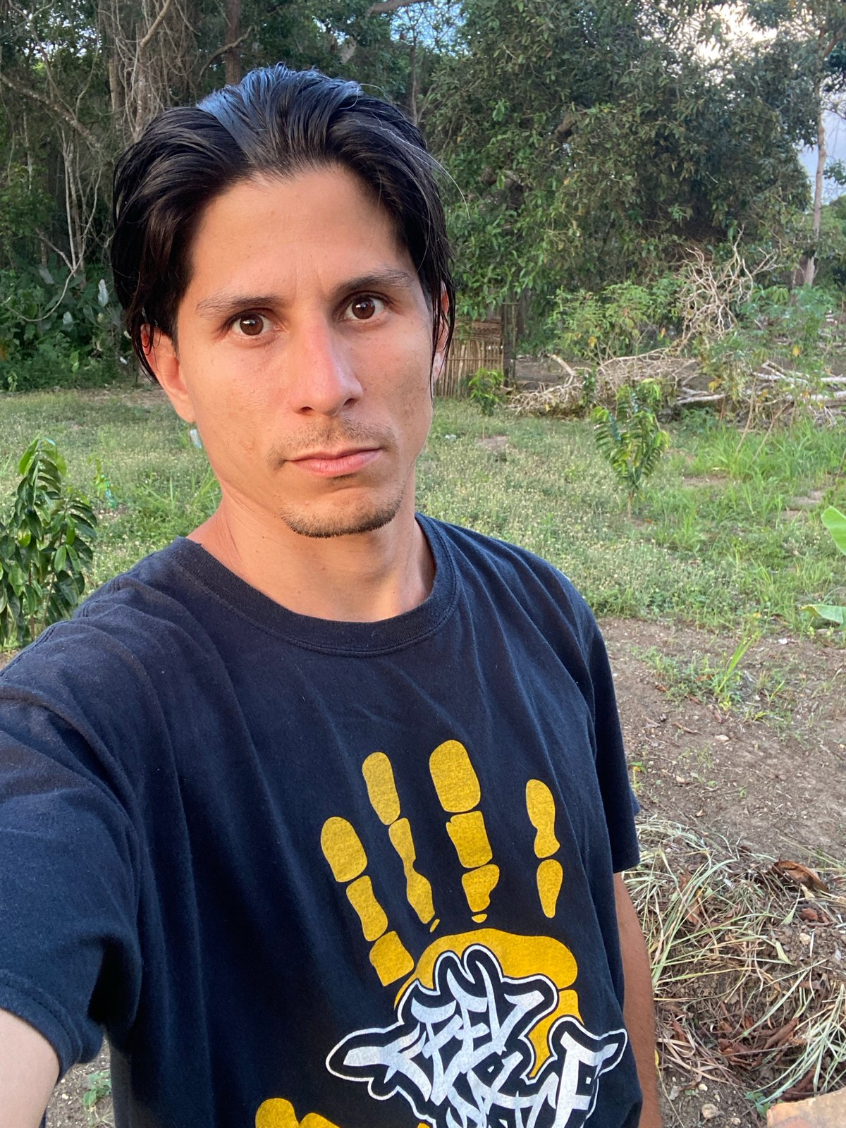 Man inspects banana and citrus crops in Venezuelan agricultural area