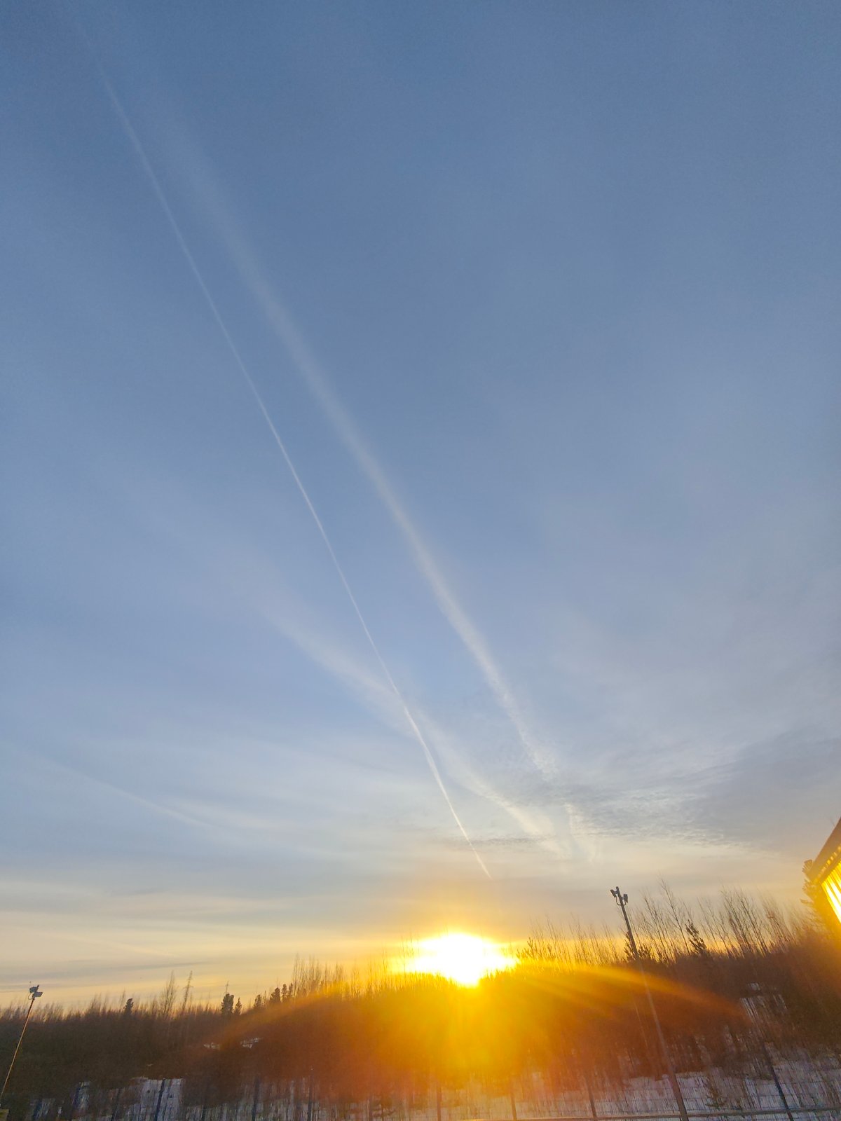 Russian industrial worker documents dawn shift in winter landscape