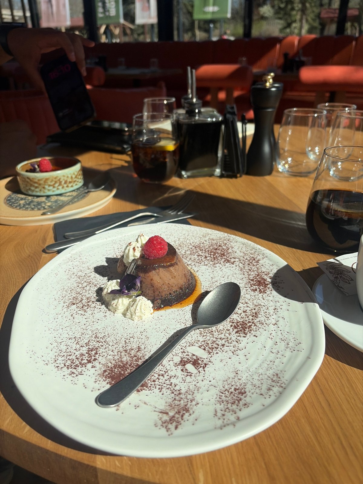 Garnished cake slice served at Sofia café