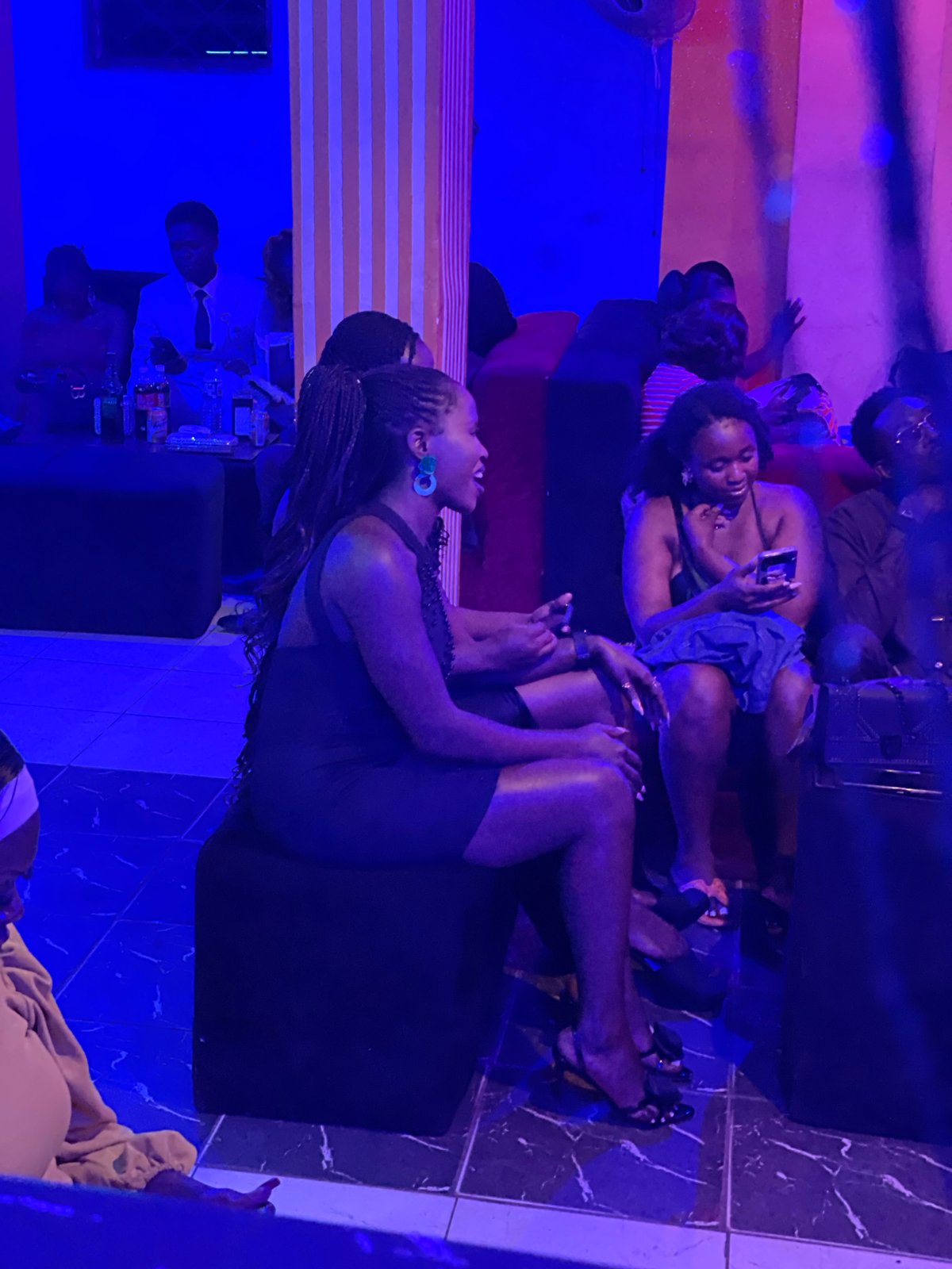 Night out at a neon-lit lounge in Durumi, Nigeria