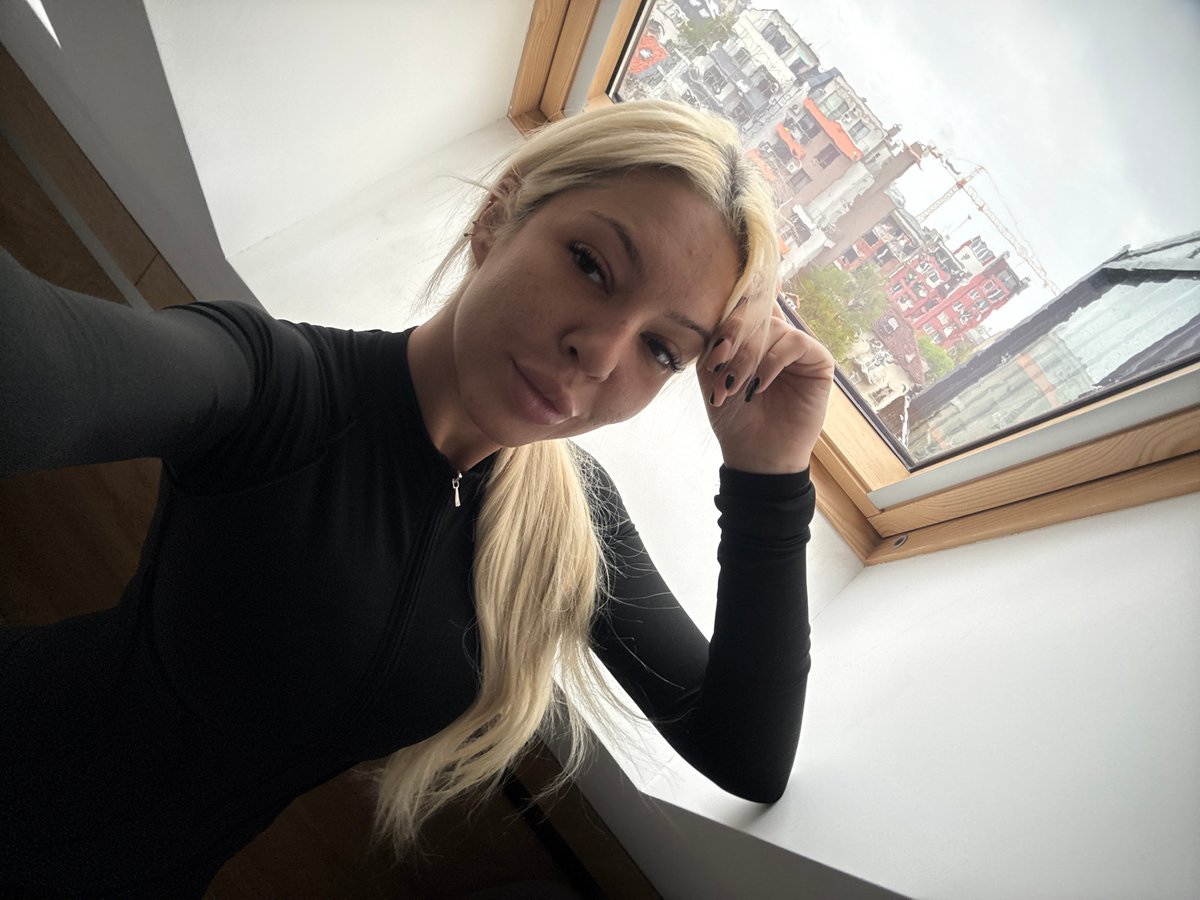 Woman takes mirror selfies in Sofia bedroom