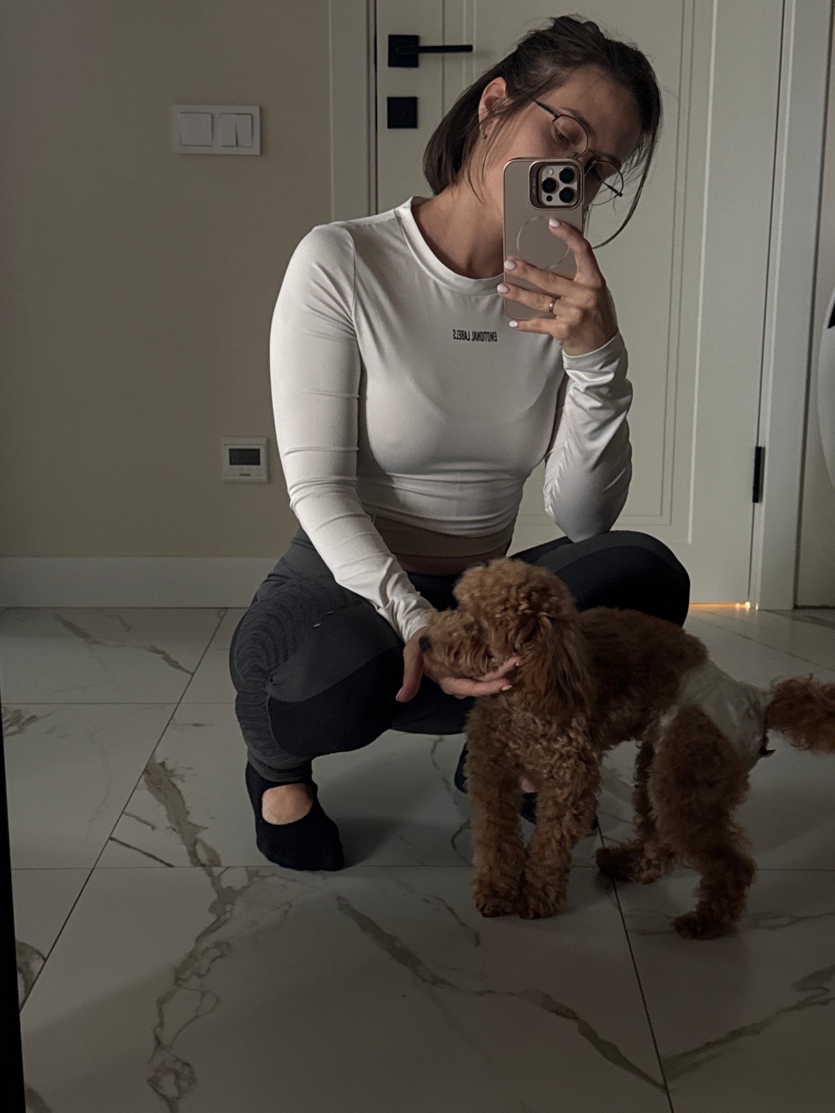 Woman takes morning selfies with dogs in Pervomaysky apartment