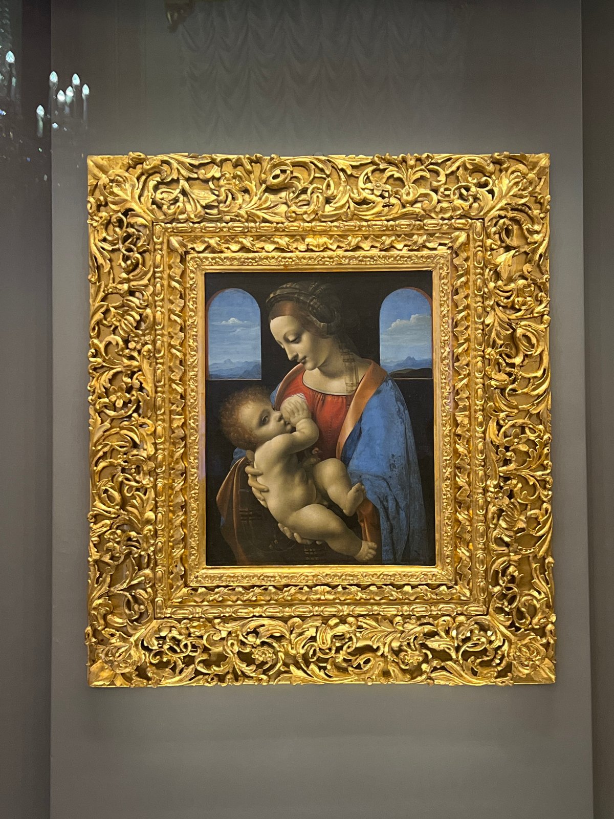 Religious artworks including Madonna painting and ceiling fresco observed