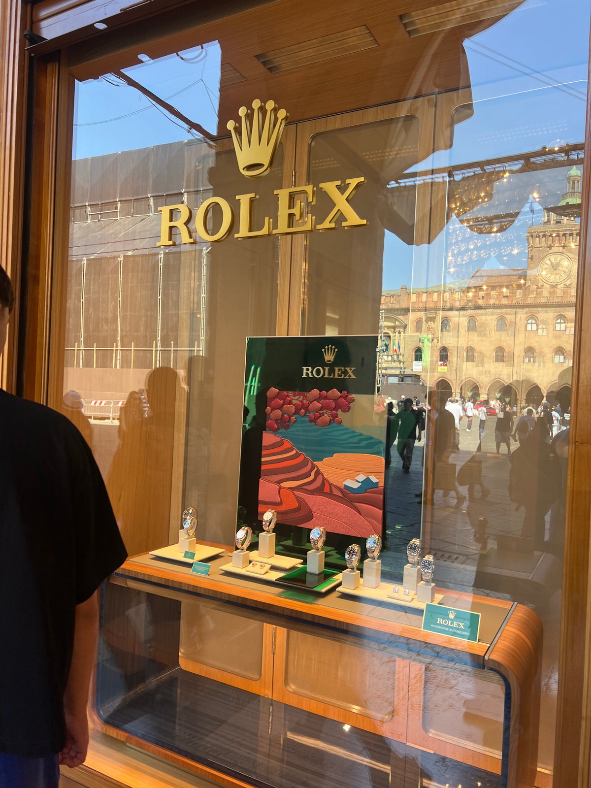 Tourist documents morning walk through historic Bologna city center