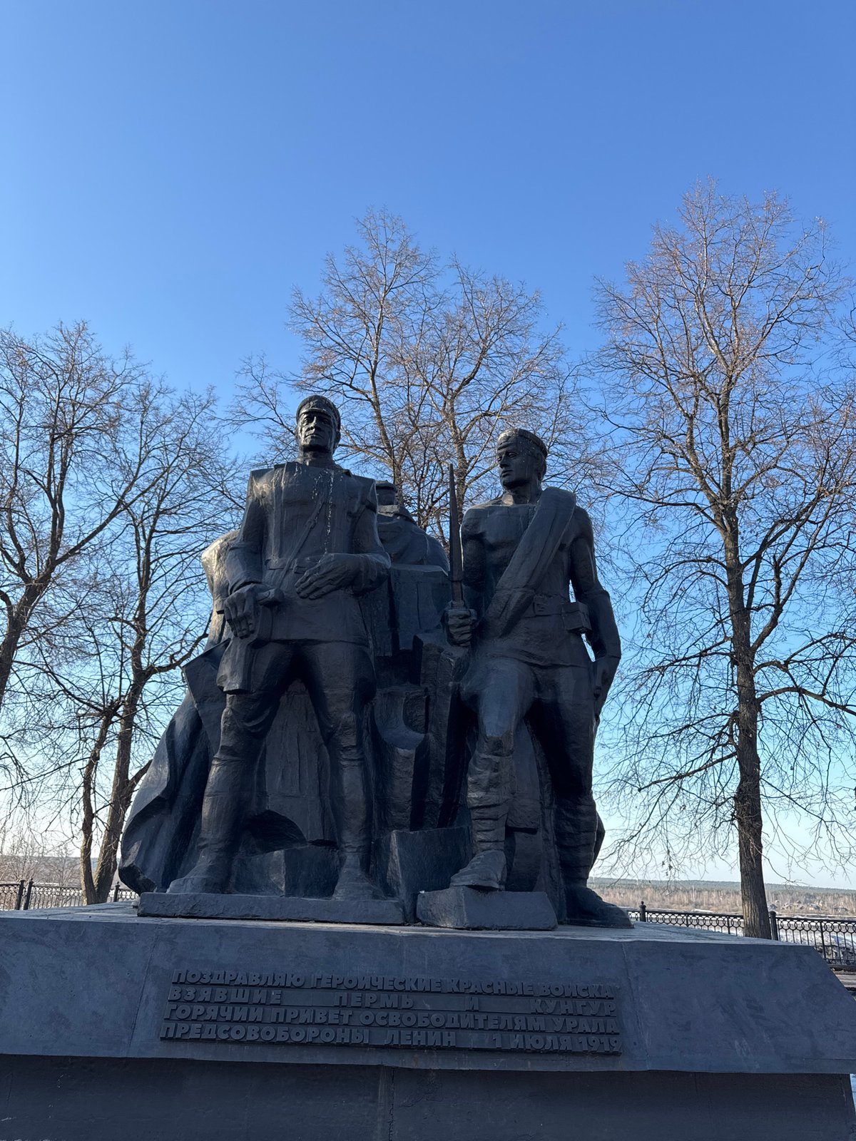 Tourists explore monuments and feed pigeons in Perm, Russia