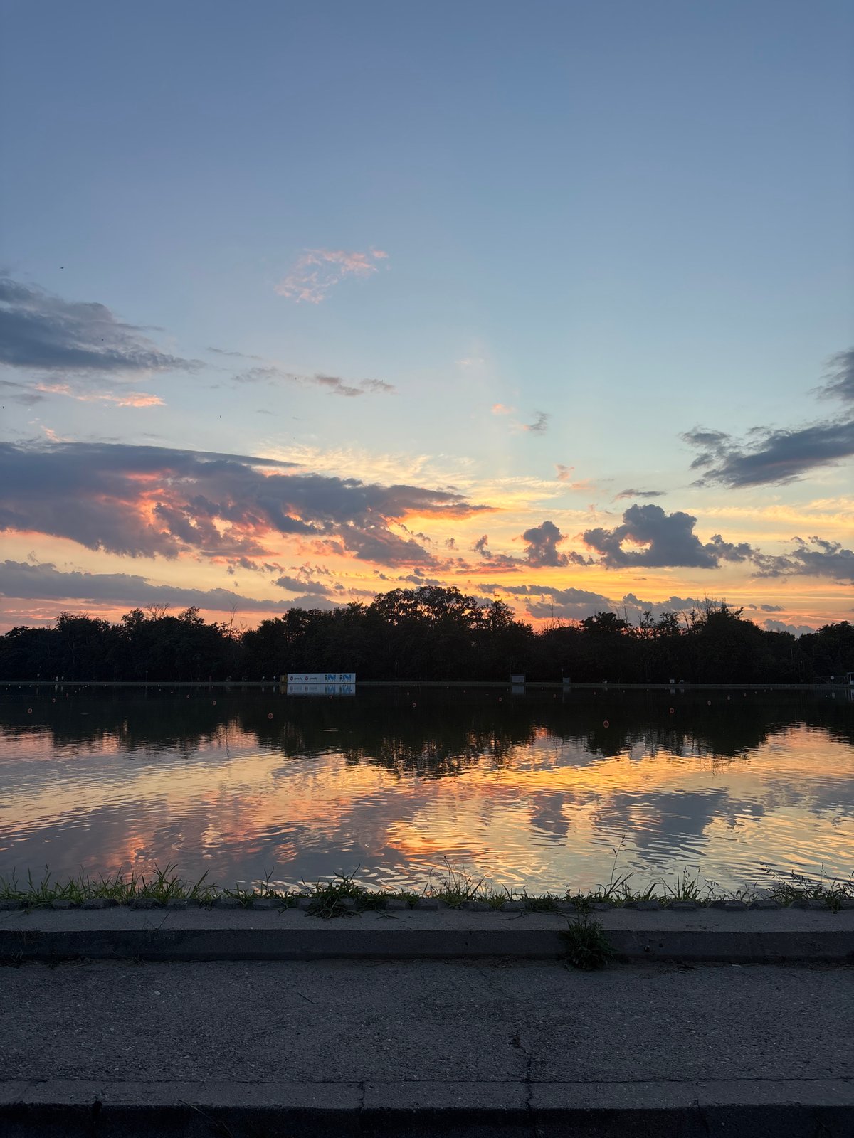 Sunset at Plovdiv's rowing canal alongside city construction views