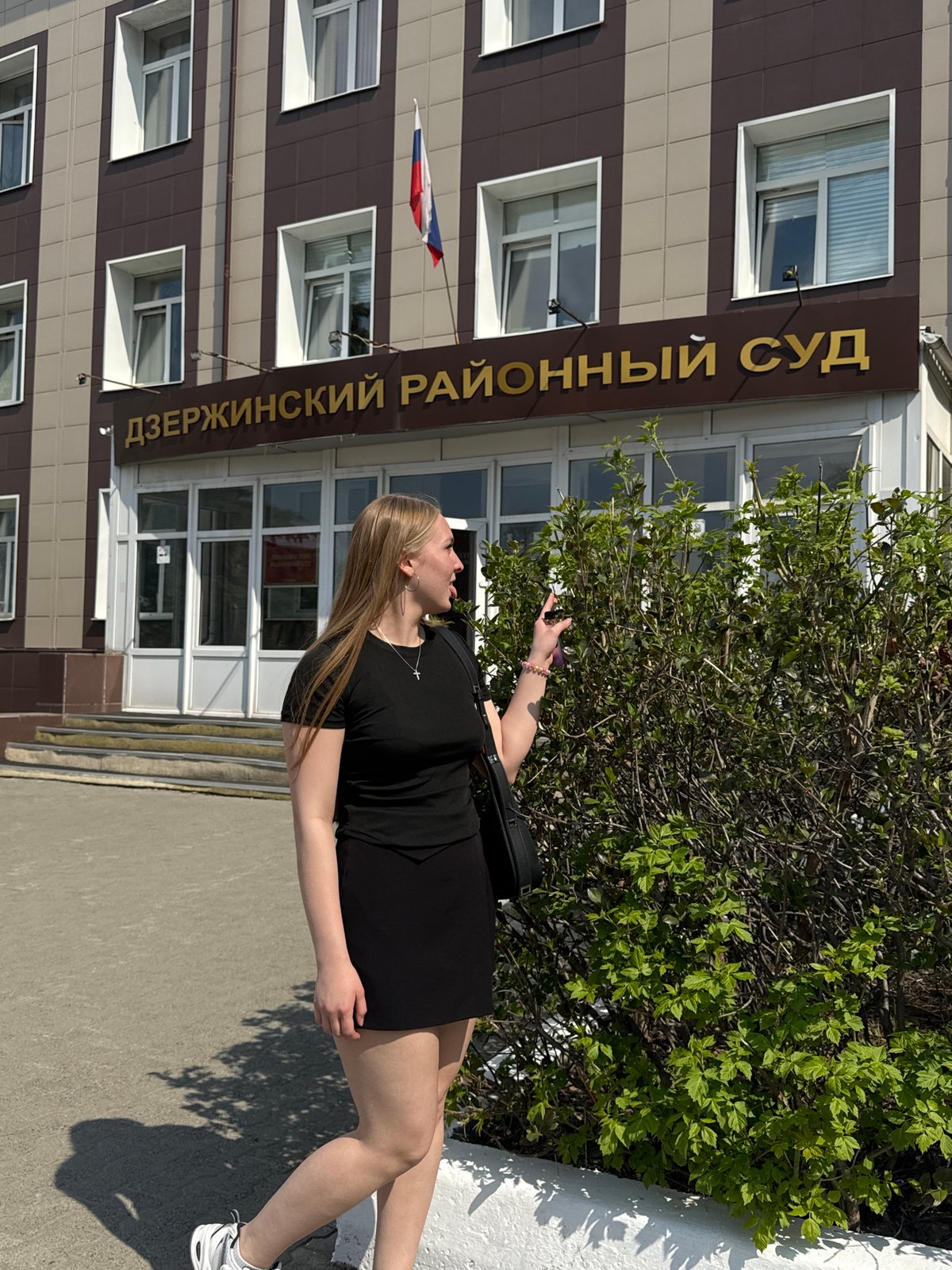 Woman photographed outside district court building in Perm, Russia