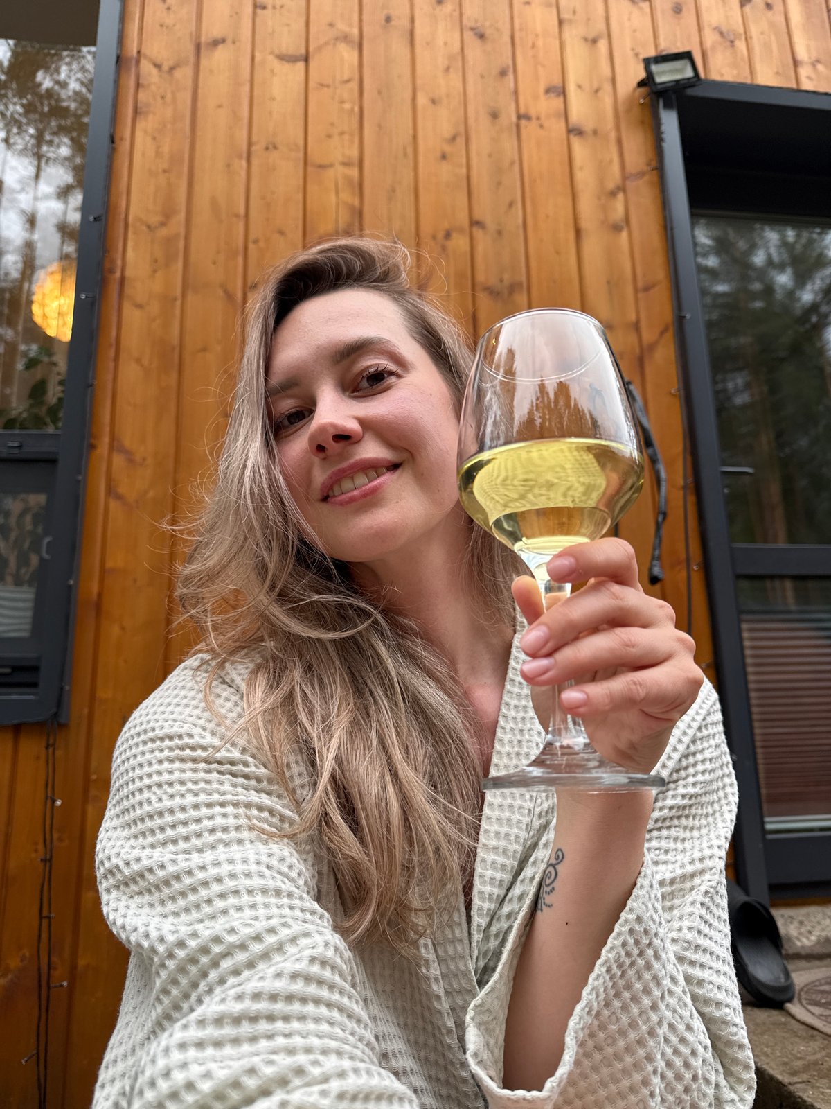 Woman enjoys leisurely afternoon at Russian forest cabin