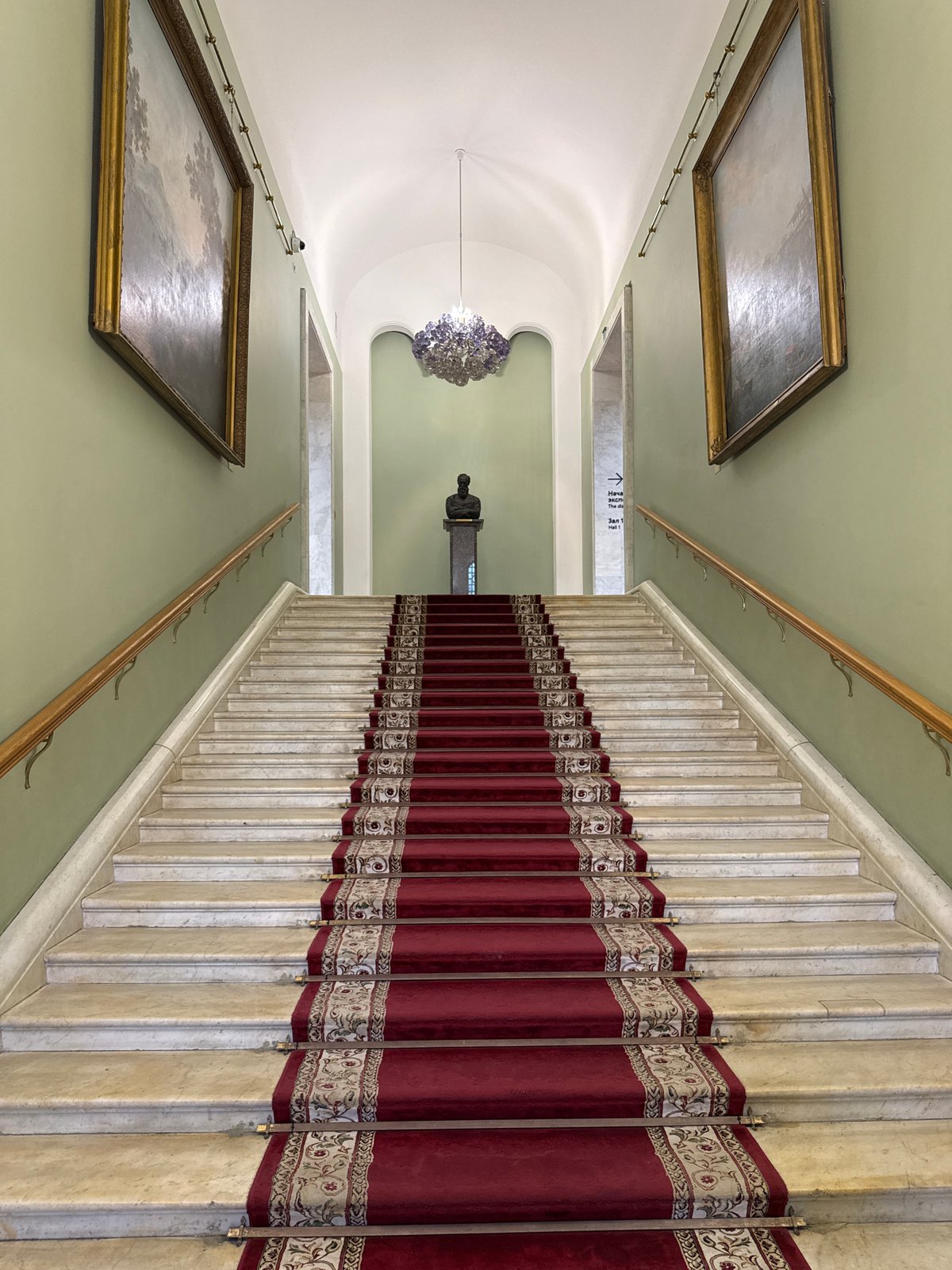 Visitor documents historic Moscow building interior and museum exhibits
