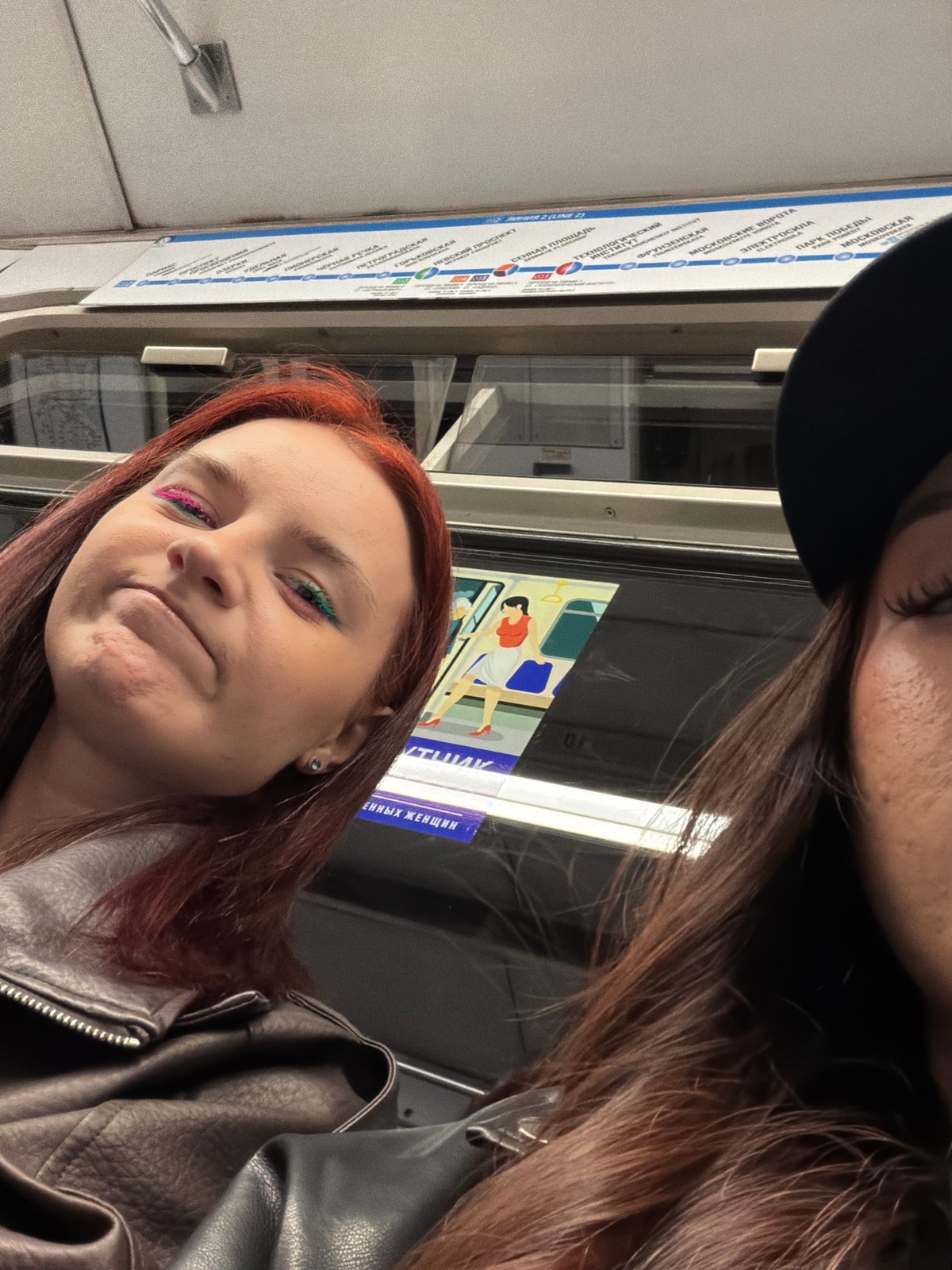 Young women photographed on subway during morning commute