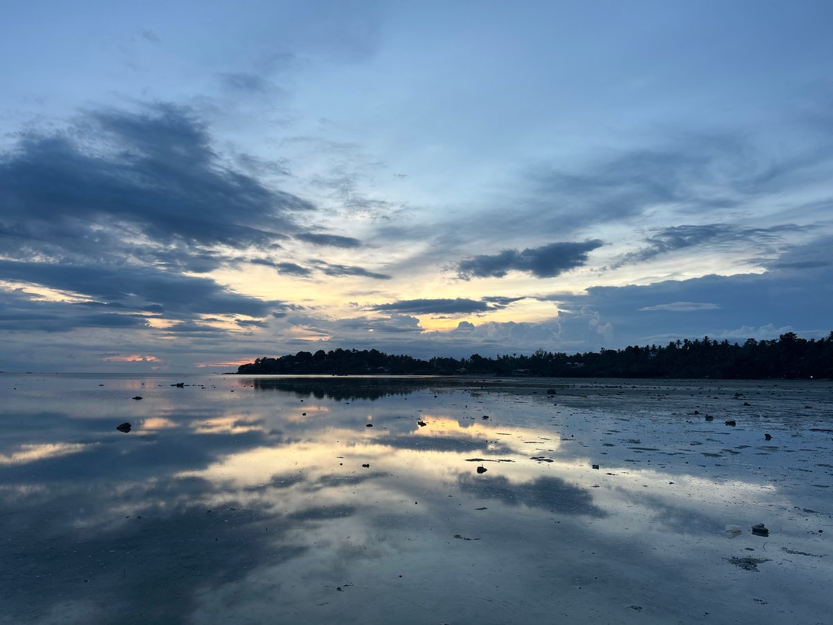 Low tide dusk on Koh Phangan, sky and sea mirroring each other