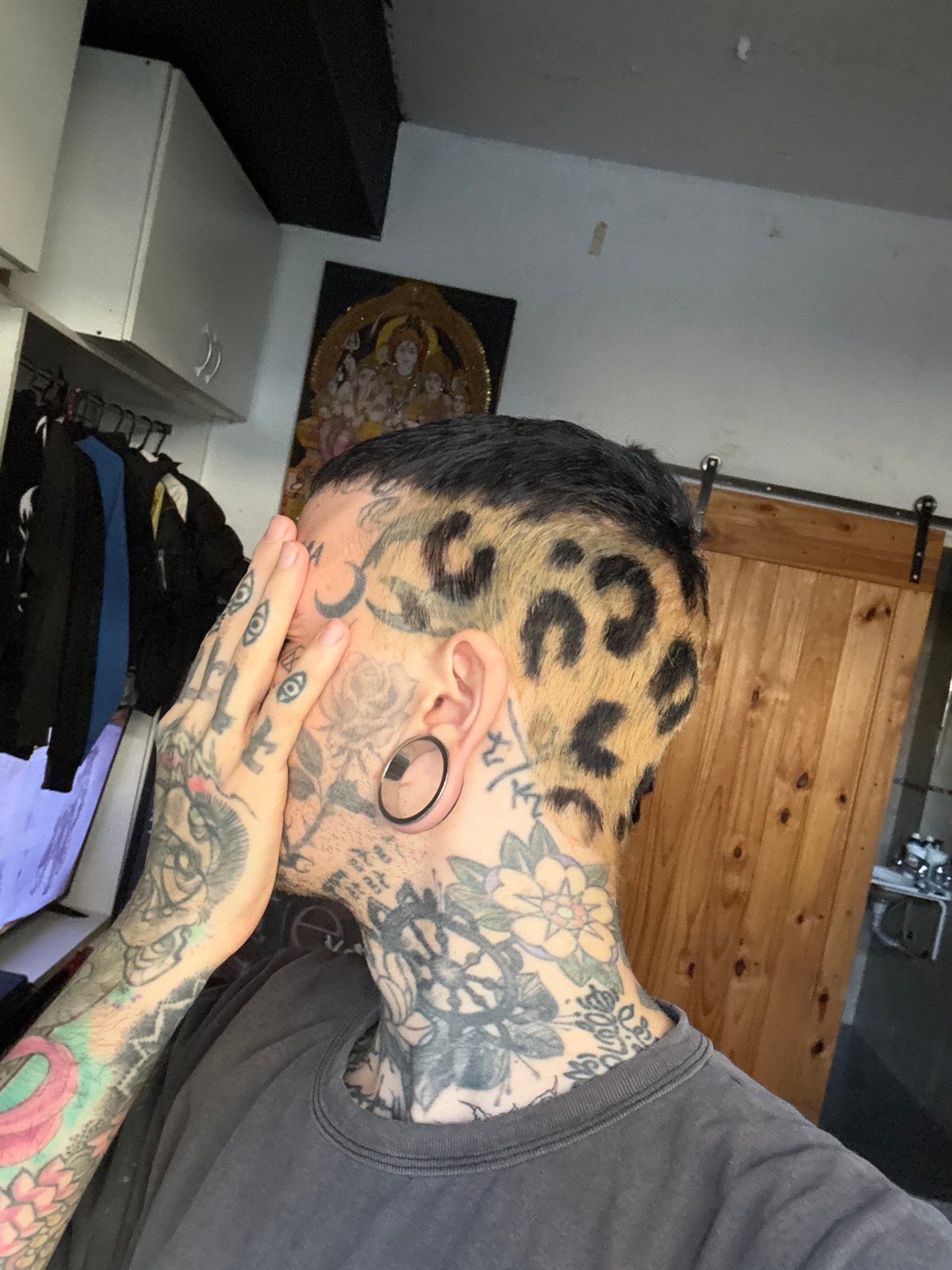 Tattooed person with leopard print hair observed in Buenos Aires