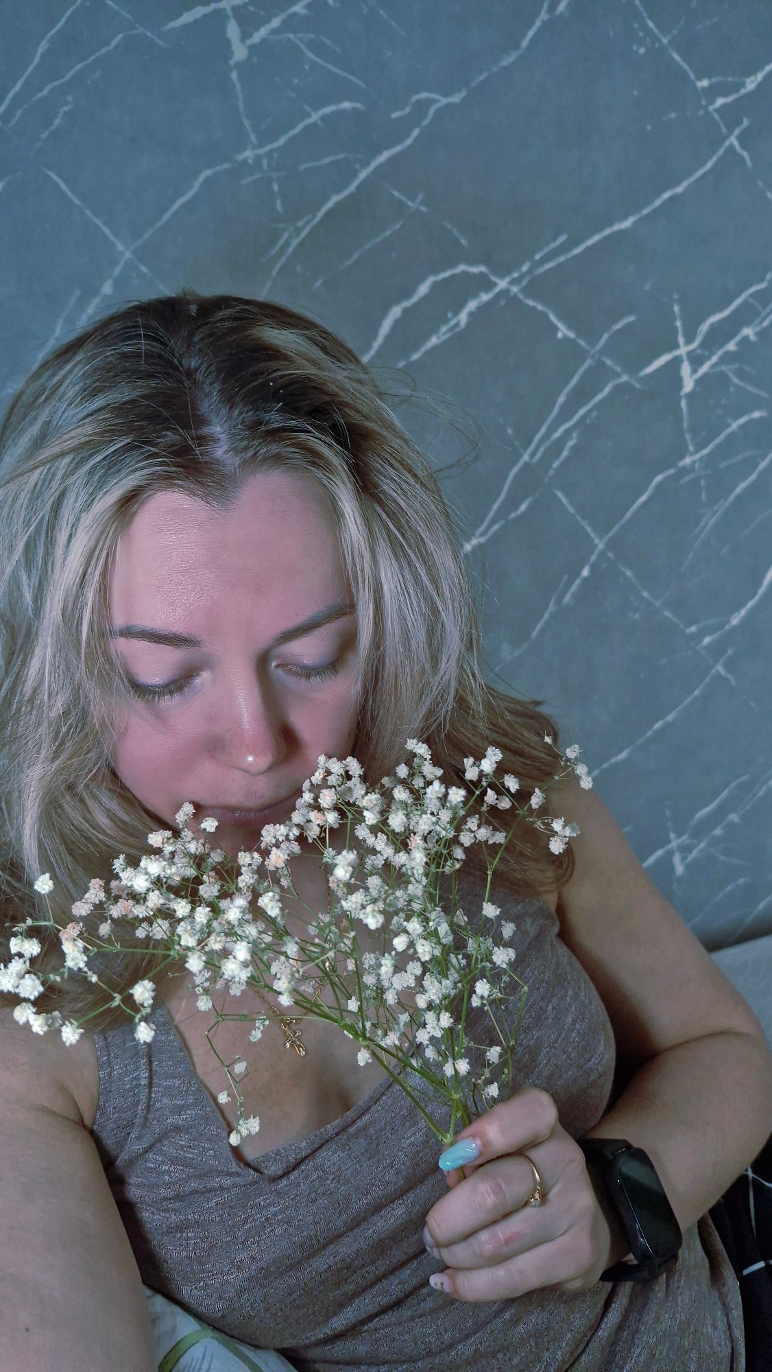 Woman photographed with baby's breath flowers in Otchor, Russia