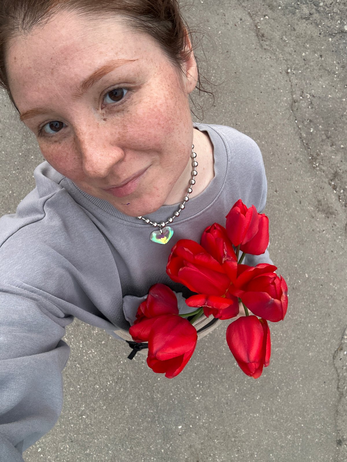 Person creates tulip memorial art with discarded windows in Russia