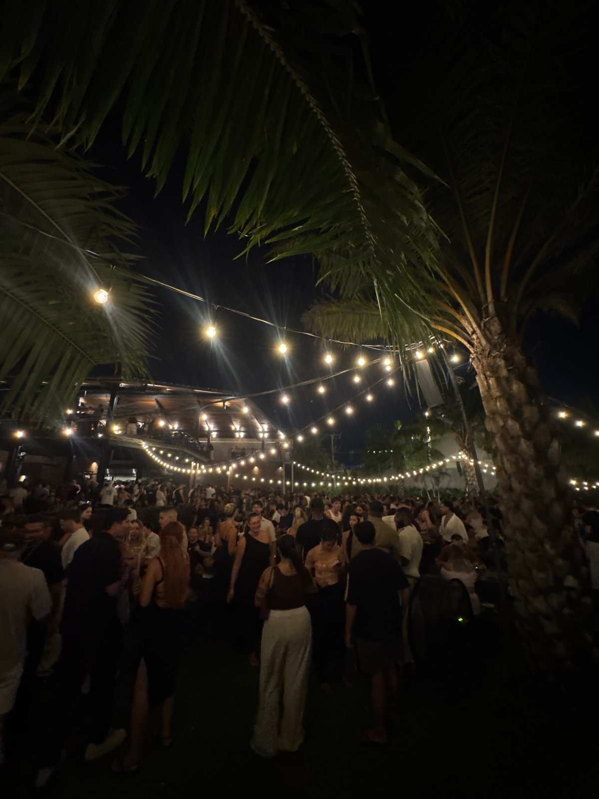 Nighttime outdoor party draws crowds in North Kuta, Indonesia