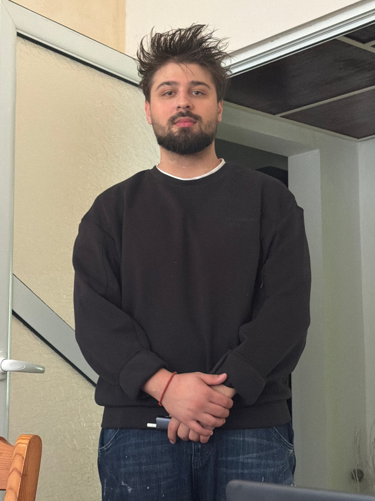 Man holds device indoors in Varna, Bulgaria