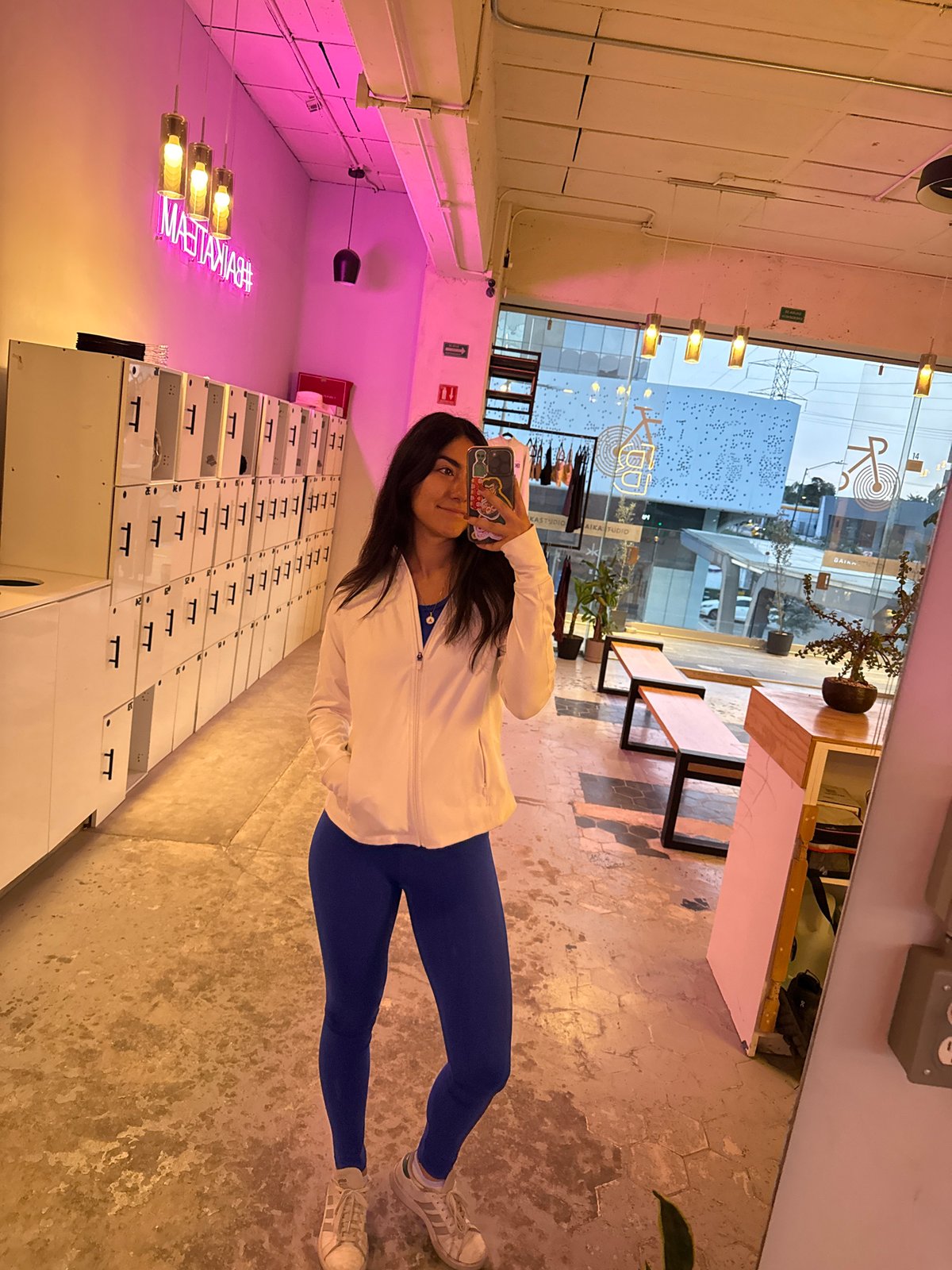 Woman Takes Mirror Selfies at Puebla Fitness Facility