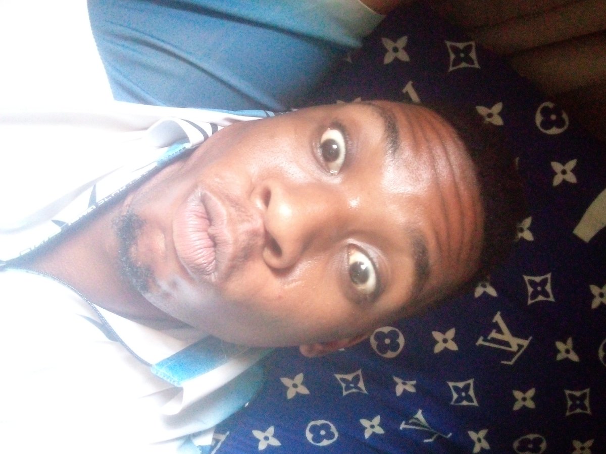 Man Takes Selfie Against Designer Fabric Background