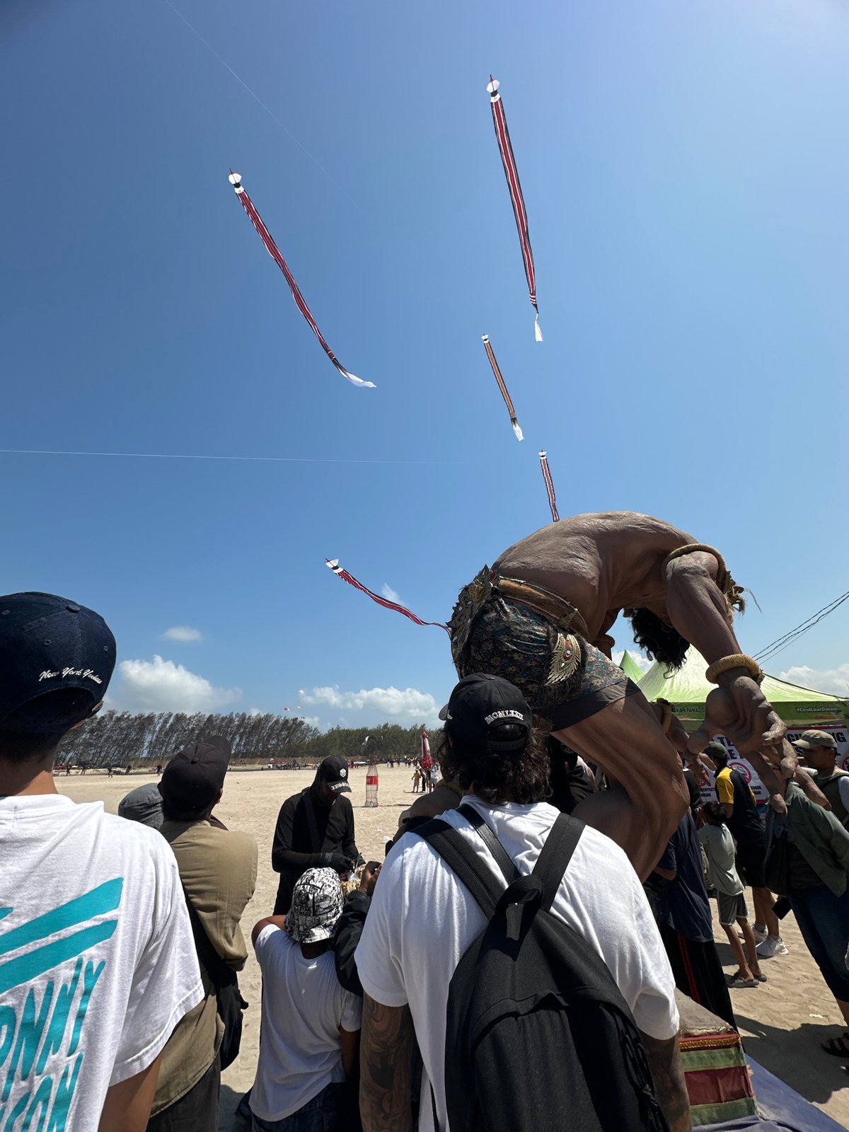 Kite festival crowd gathers on a Denpasar beach