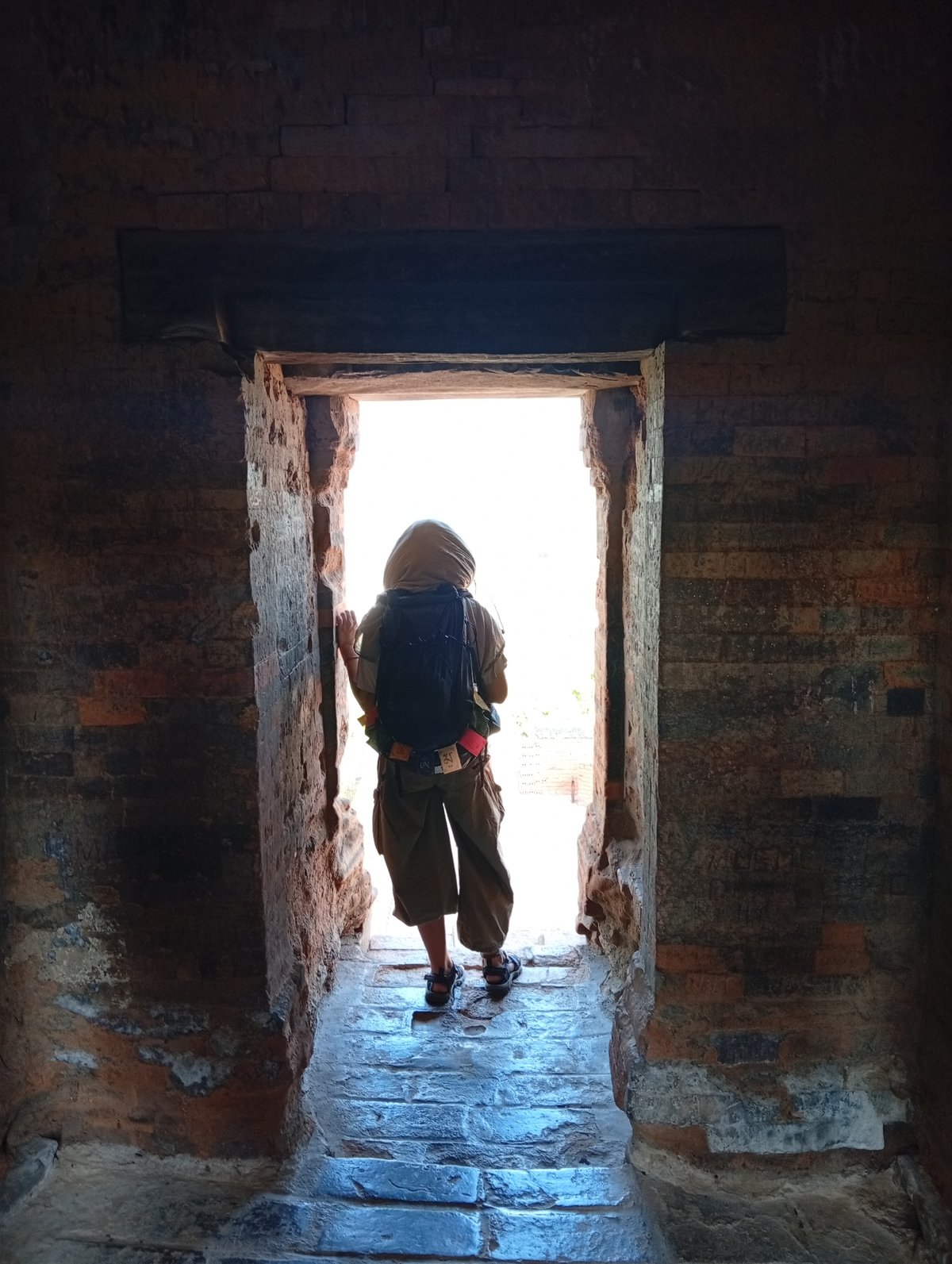 Person stands in ancient doorway in Phan Rang, Vietnam